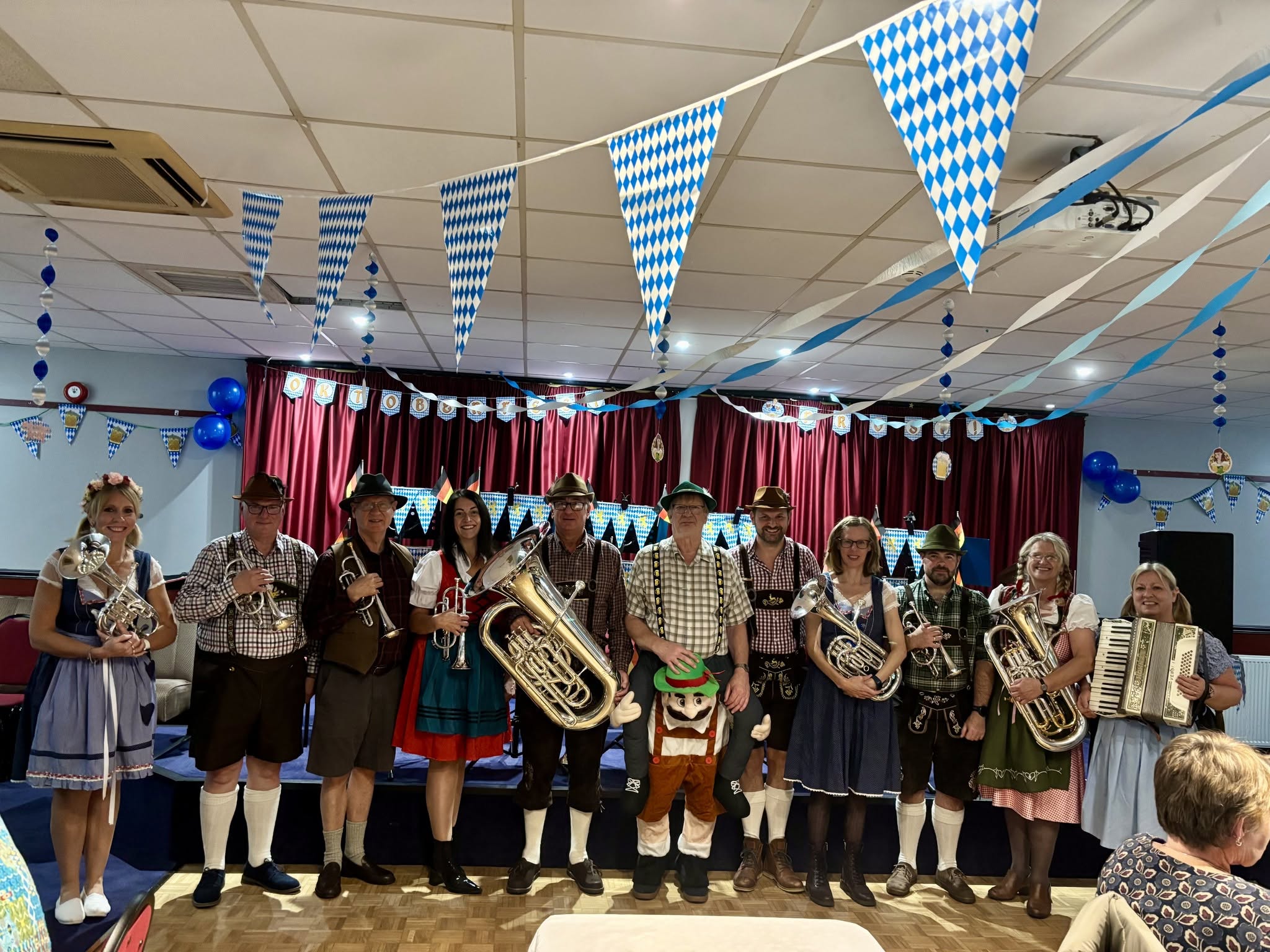 Band members posing in Bavarian costume