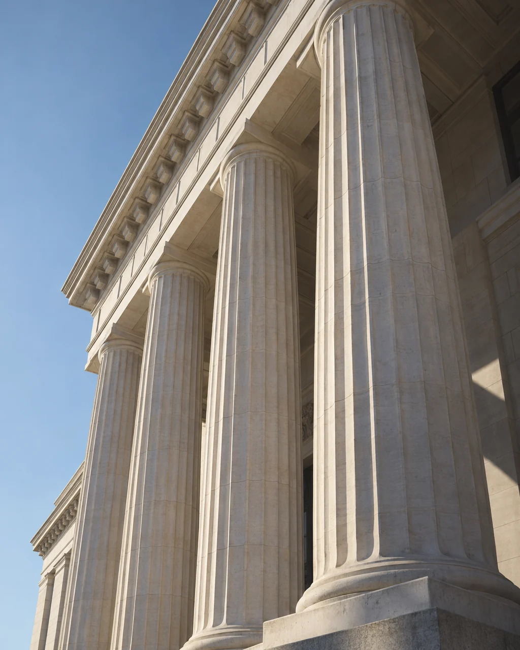 Sunlight on the columns of a classical stone building