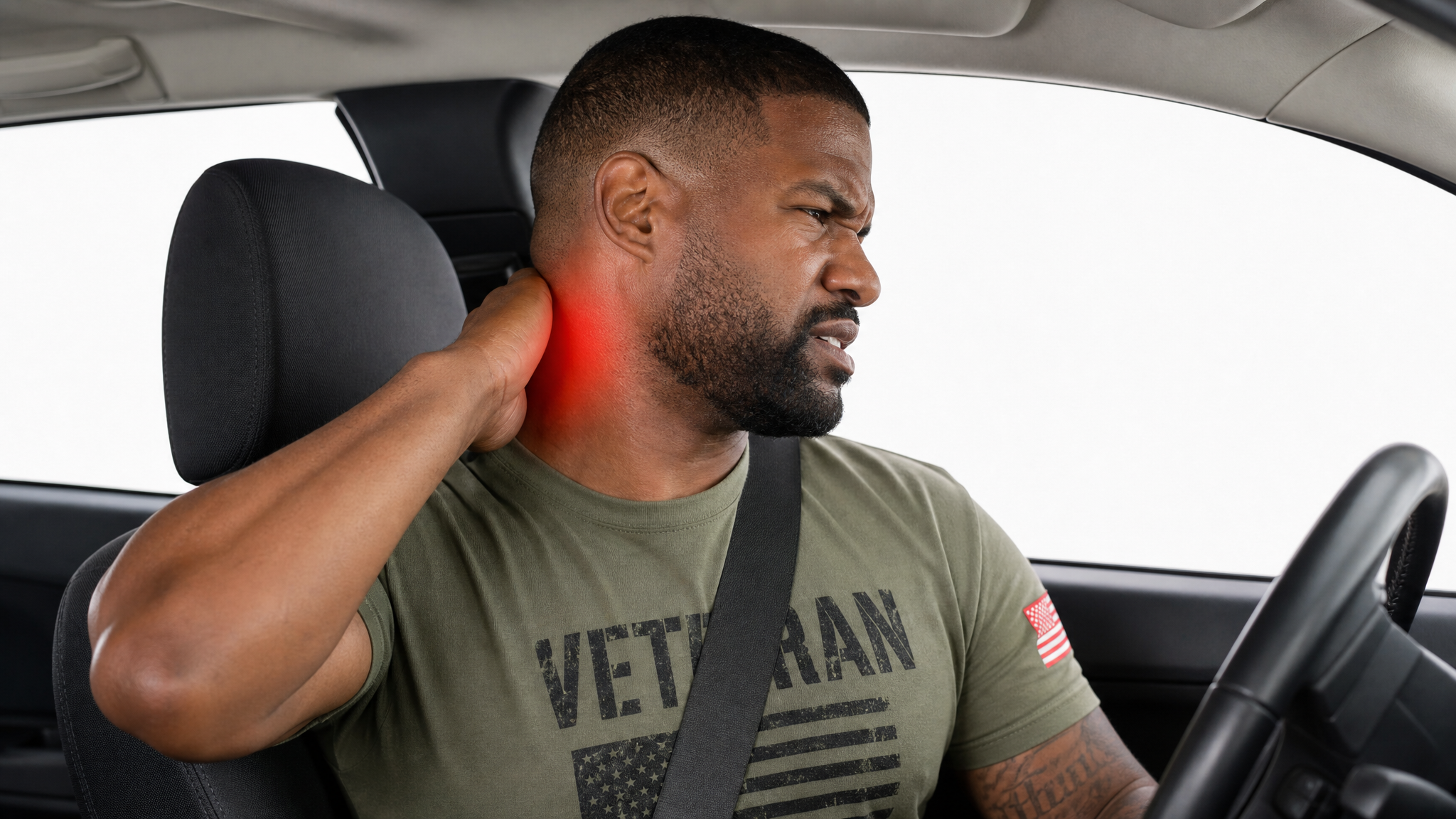 Clinical teaching photograph of a Black male veteran wincing as he tries to turn his head to check over his shoulder, one hand on his neck, with a red hotspot over the cervical spine