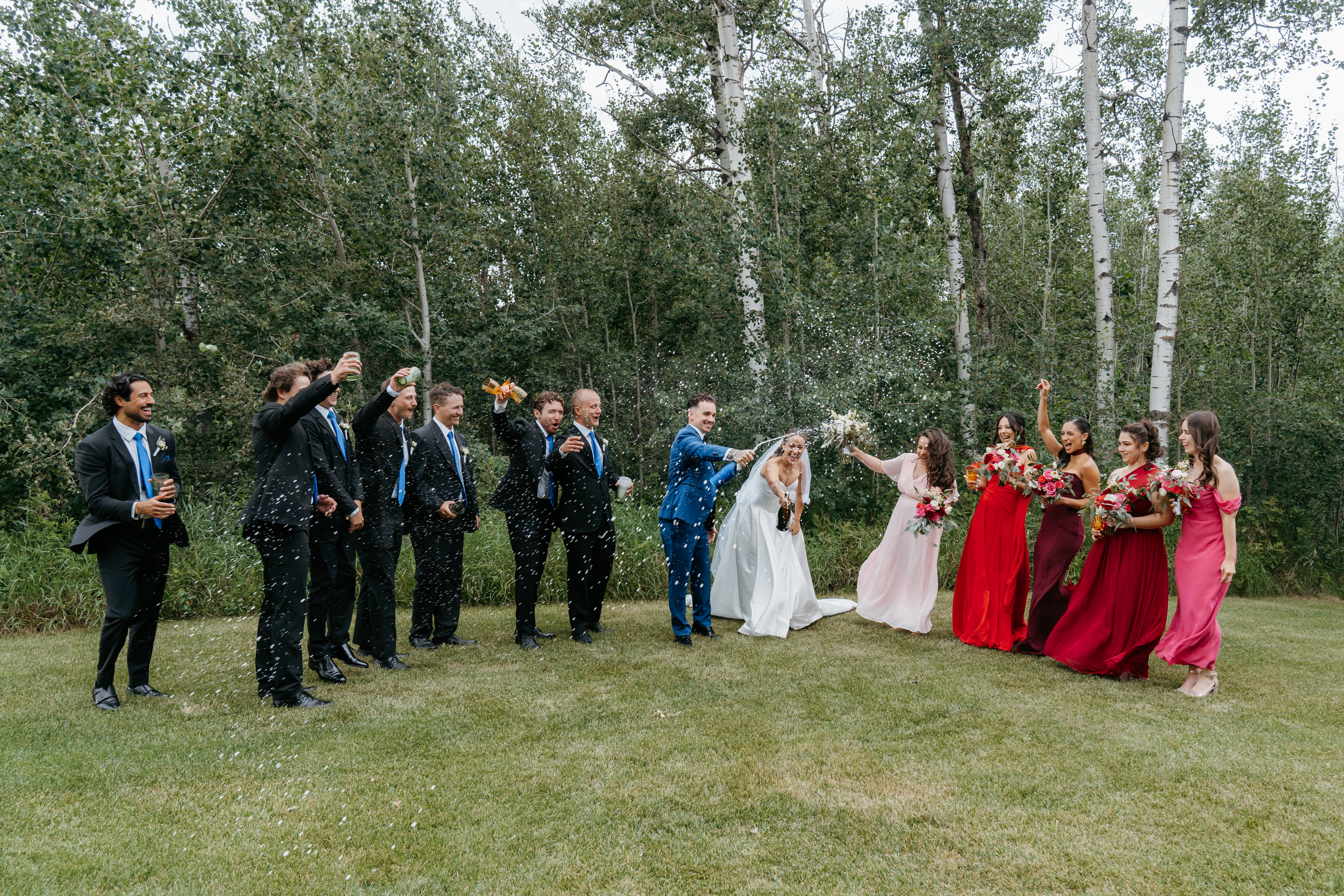 Bridesmaids with coordinated floral bouquets