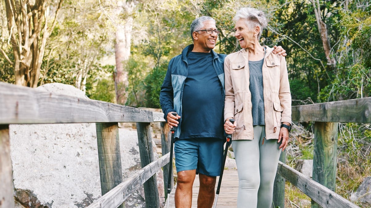 Active healthy couple enjoying an outdoor walk together