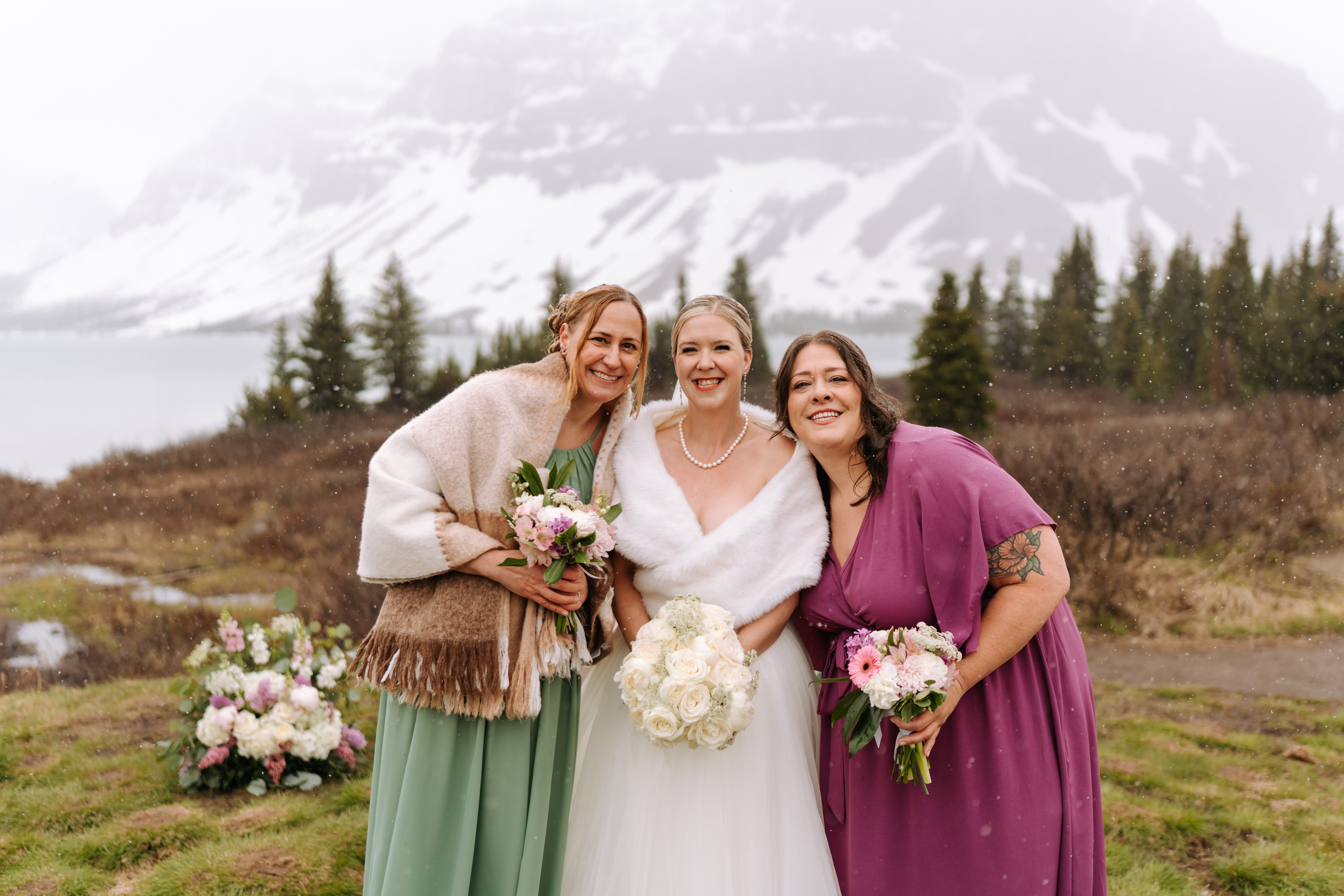 Groom awaiting bride with mountain backdrop