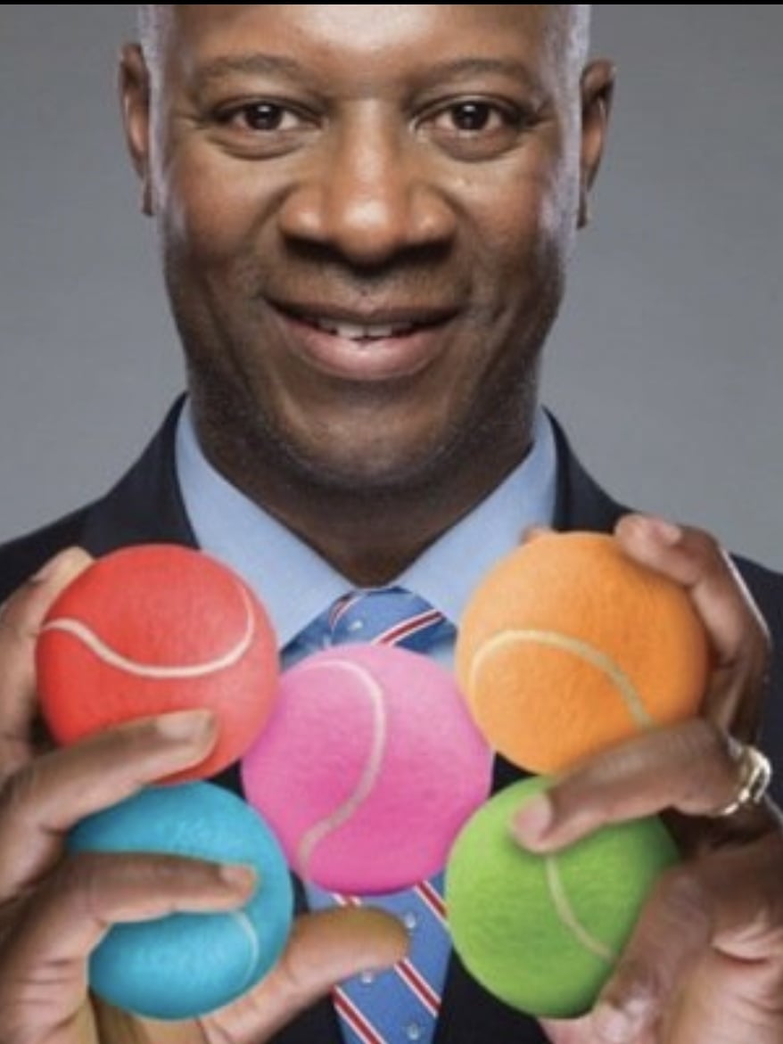 D.A. Abrams holding colorful tennis balls