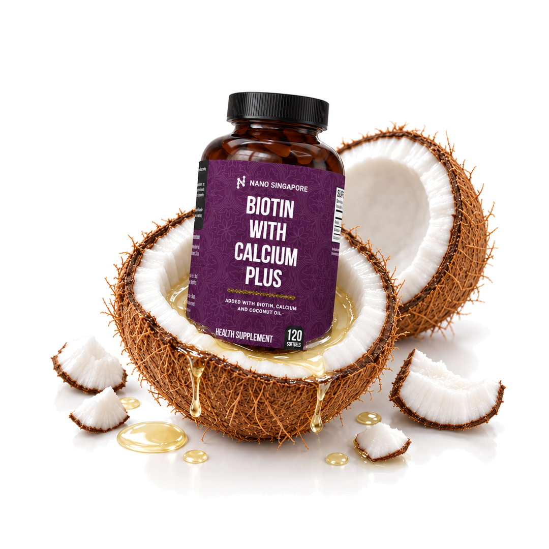 Nano Singapore Biotin With Calcium Plus bottle nestled in an open coconut with coconut oil dripping