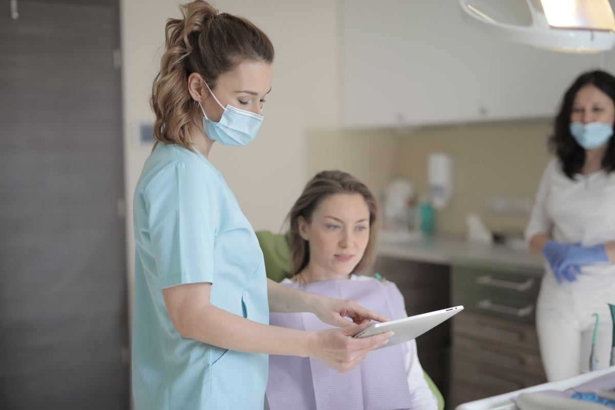 Dental professionals preparing for emergency patient care
