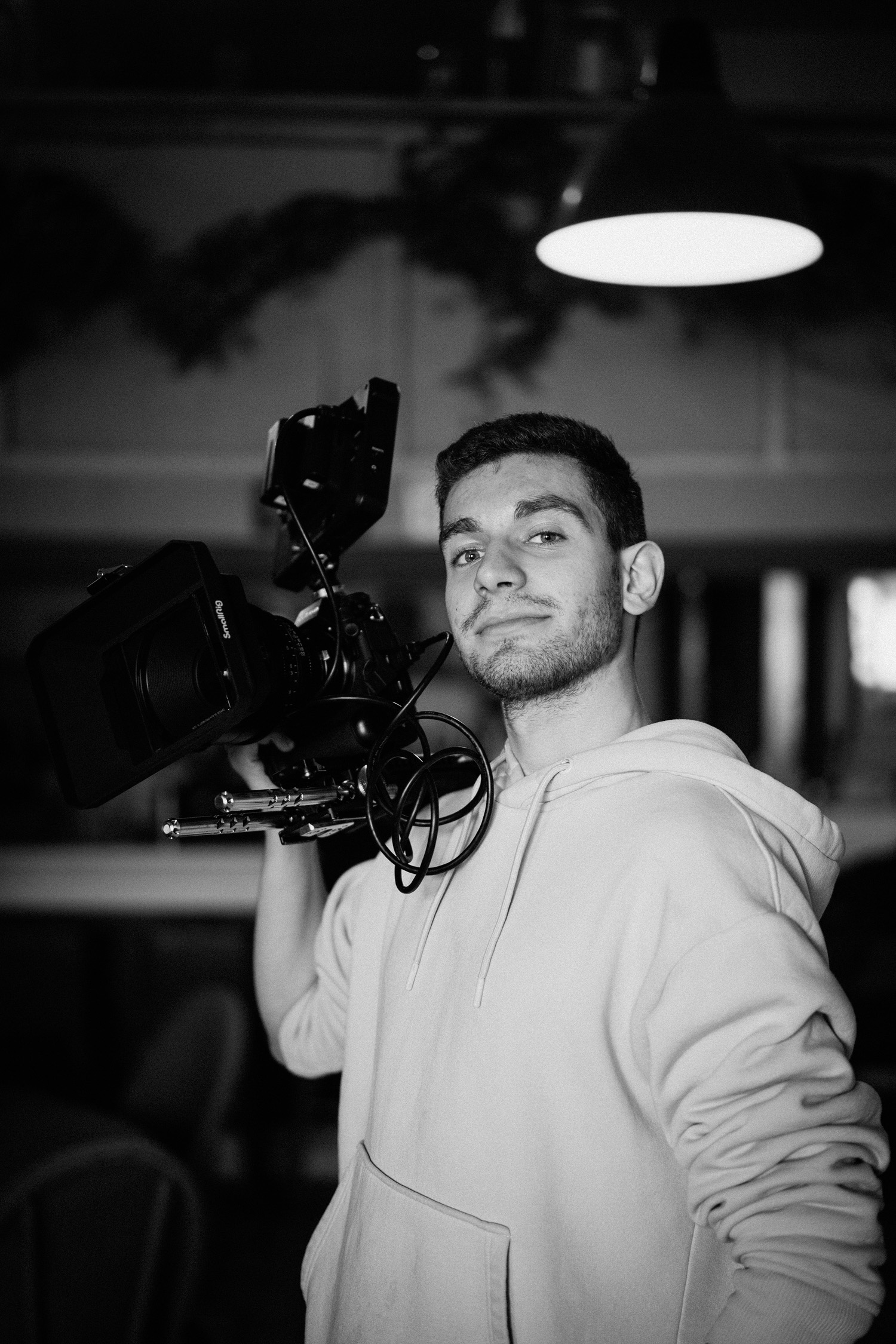Bruno operating a cinema camera on location