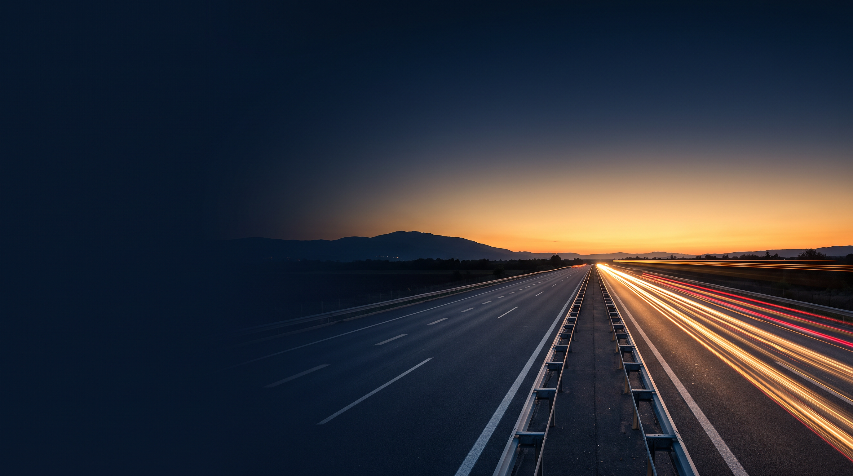 An open highway at golden hour stretching toward the horizon