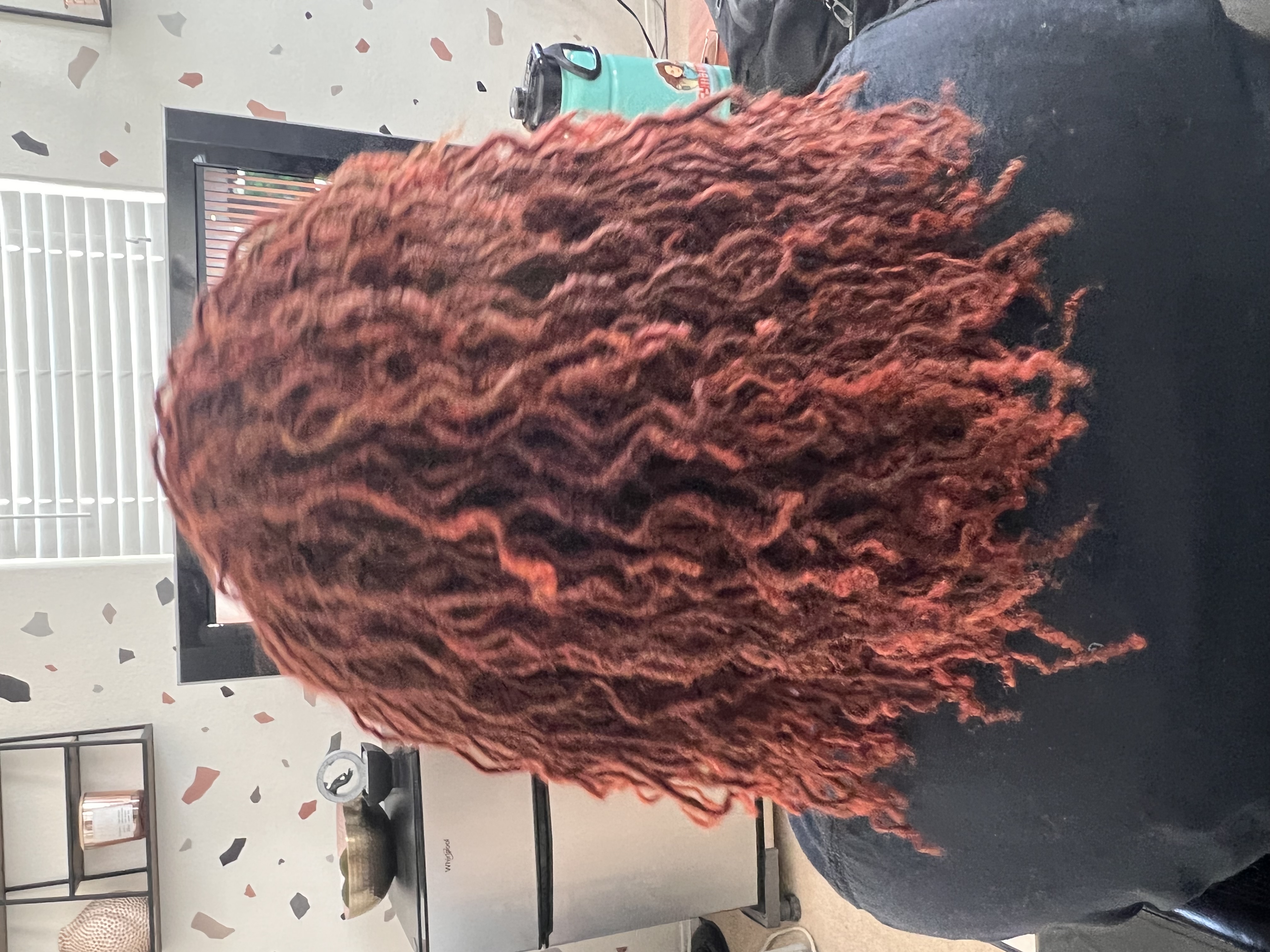 Vibrant copper-red curled microlocks with gorgeous color and volume at CandieLocks Las Vegas