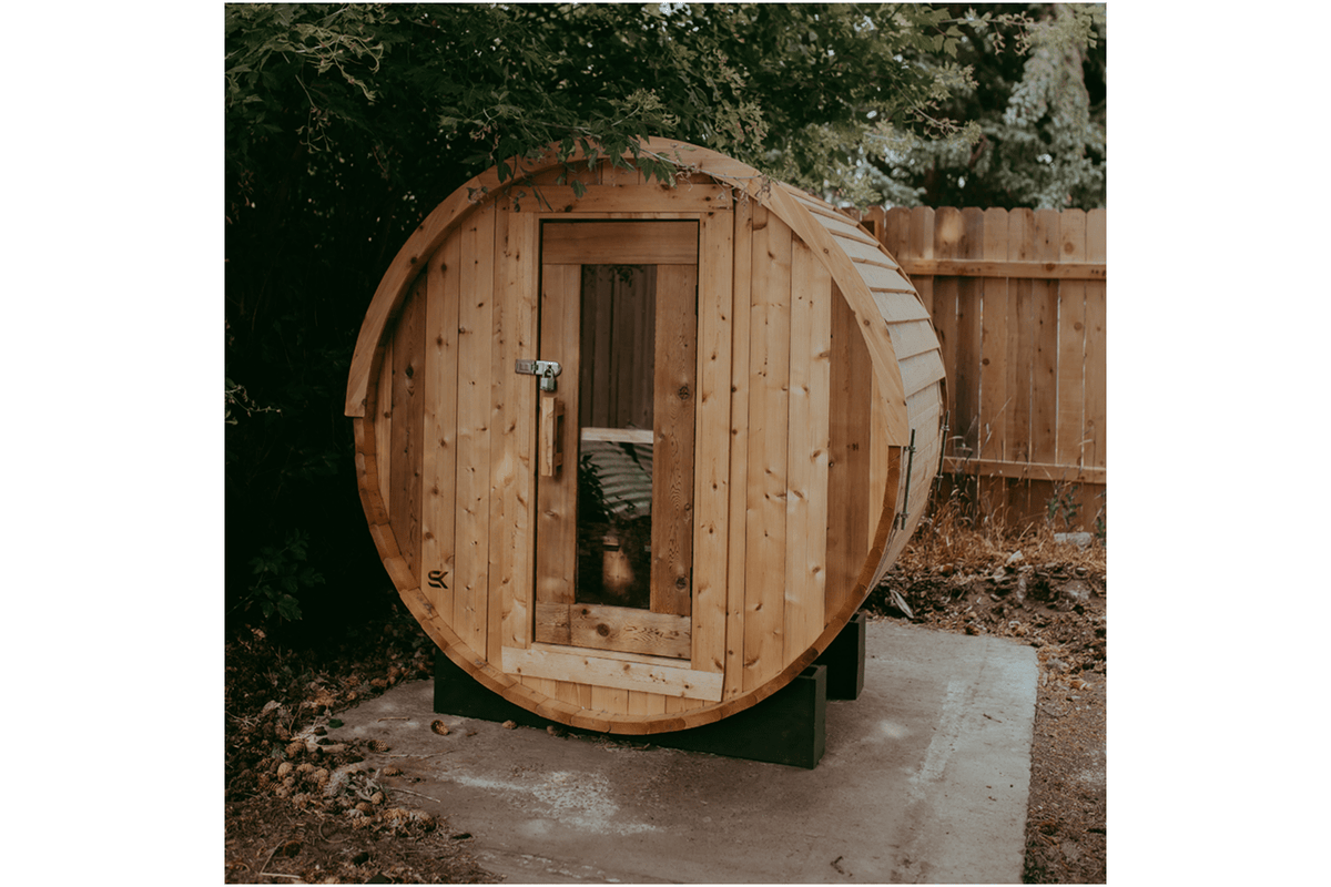 Sweat Kingdom barrel sauna in outdoor backyard setting