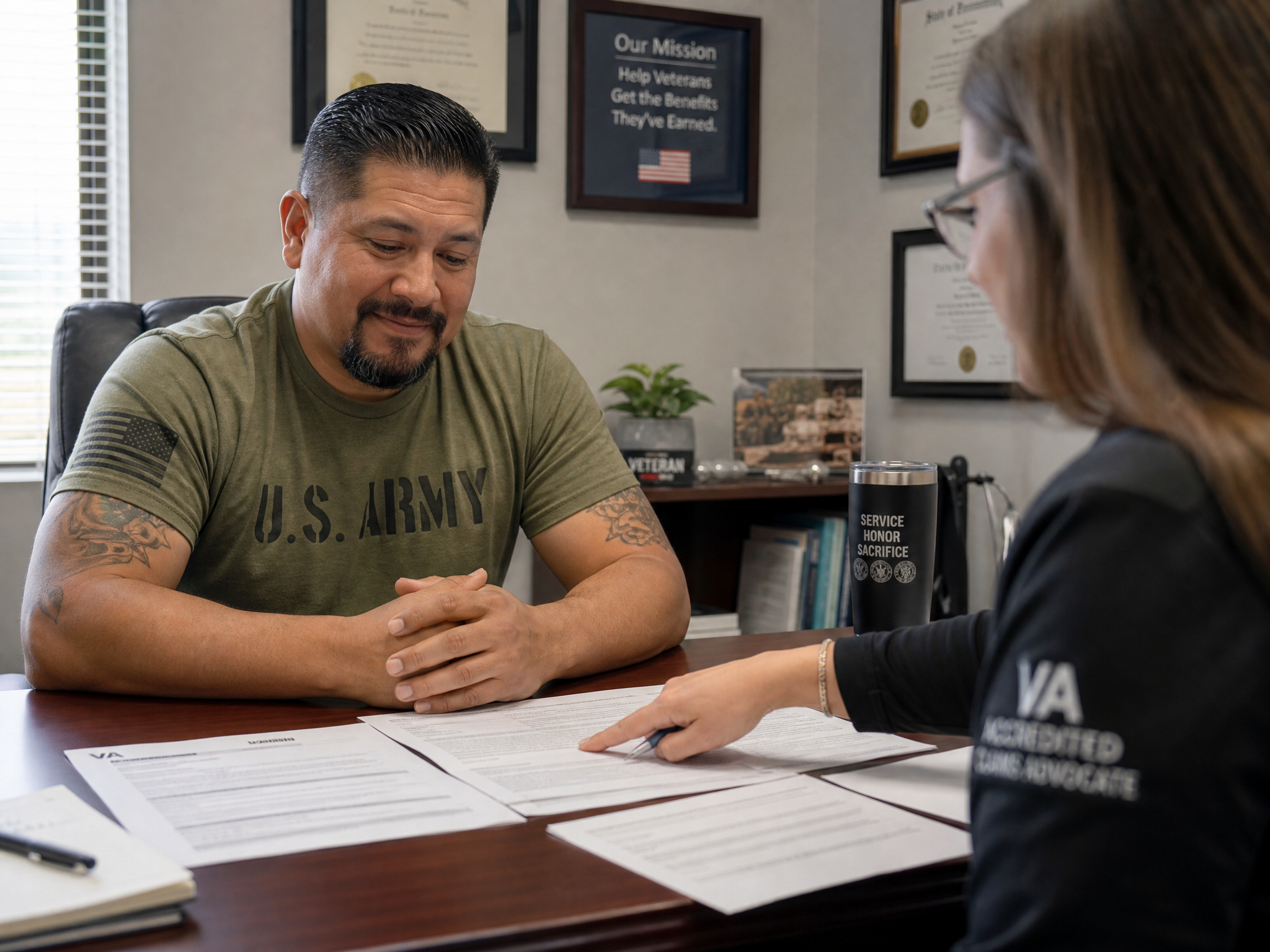 A veteran meeting with an accredited claims advocate across a desk