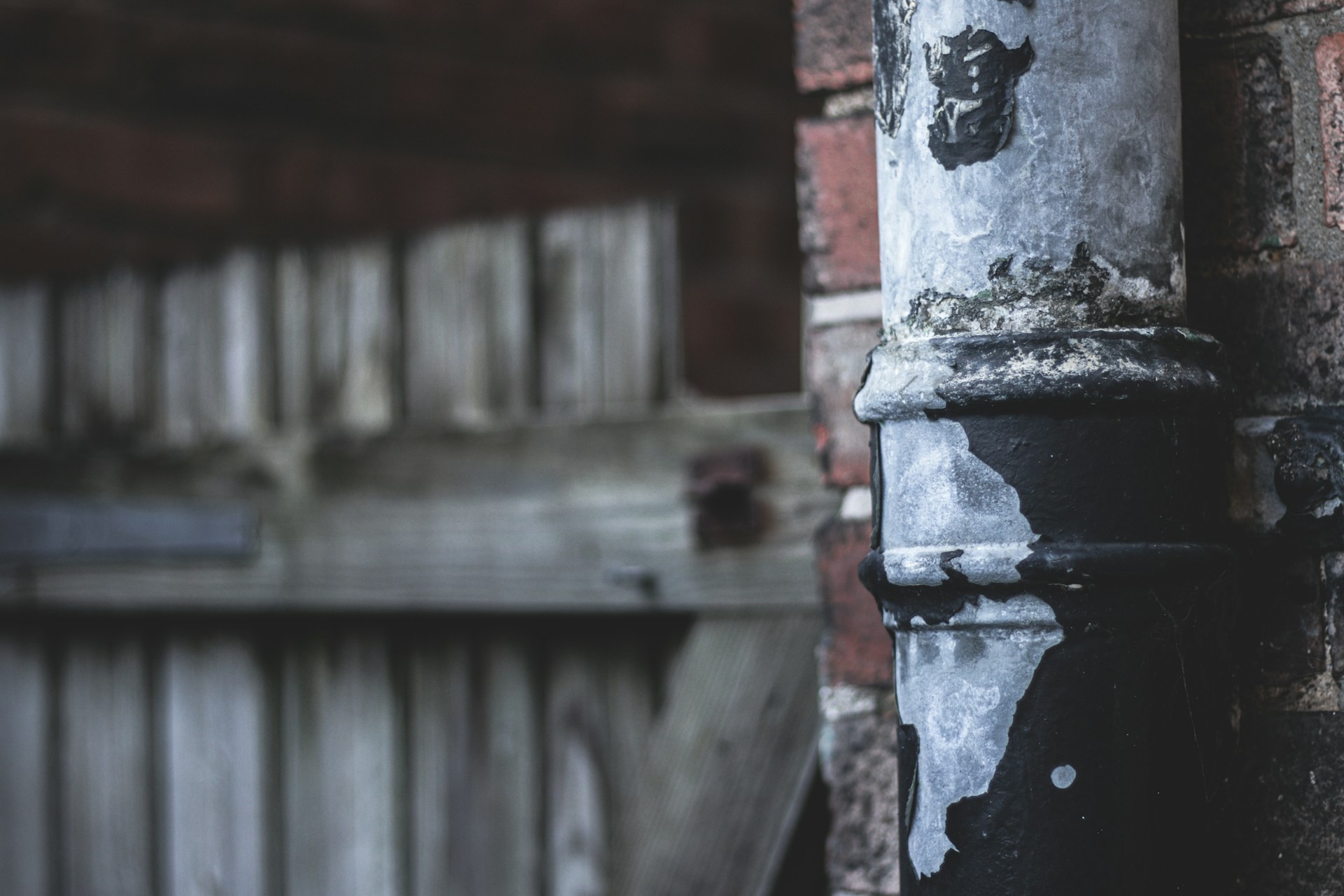 Old cracked cast iron downpipe