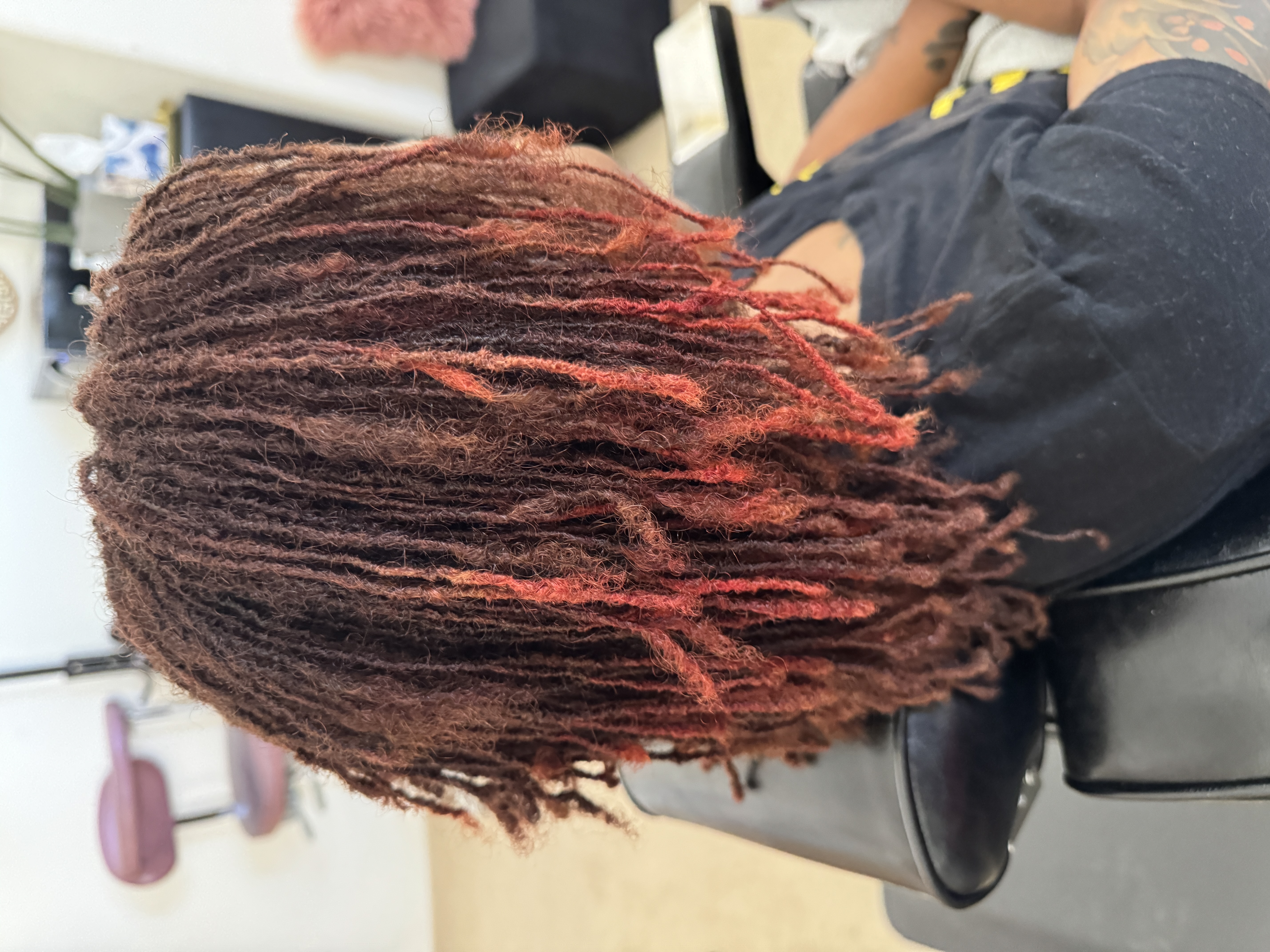 Bold red-toned microlocks with beautiful color blend and natural texture by CandieLocks