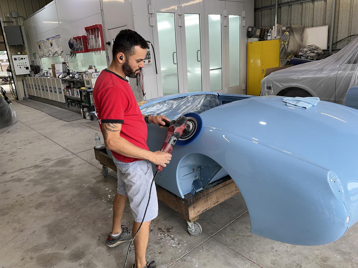 Blue classic car with perfect paint finish in showroom quality
