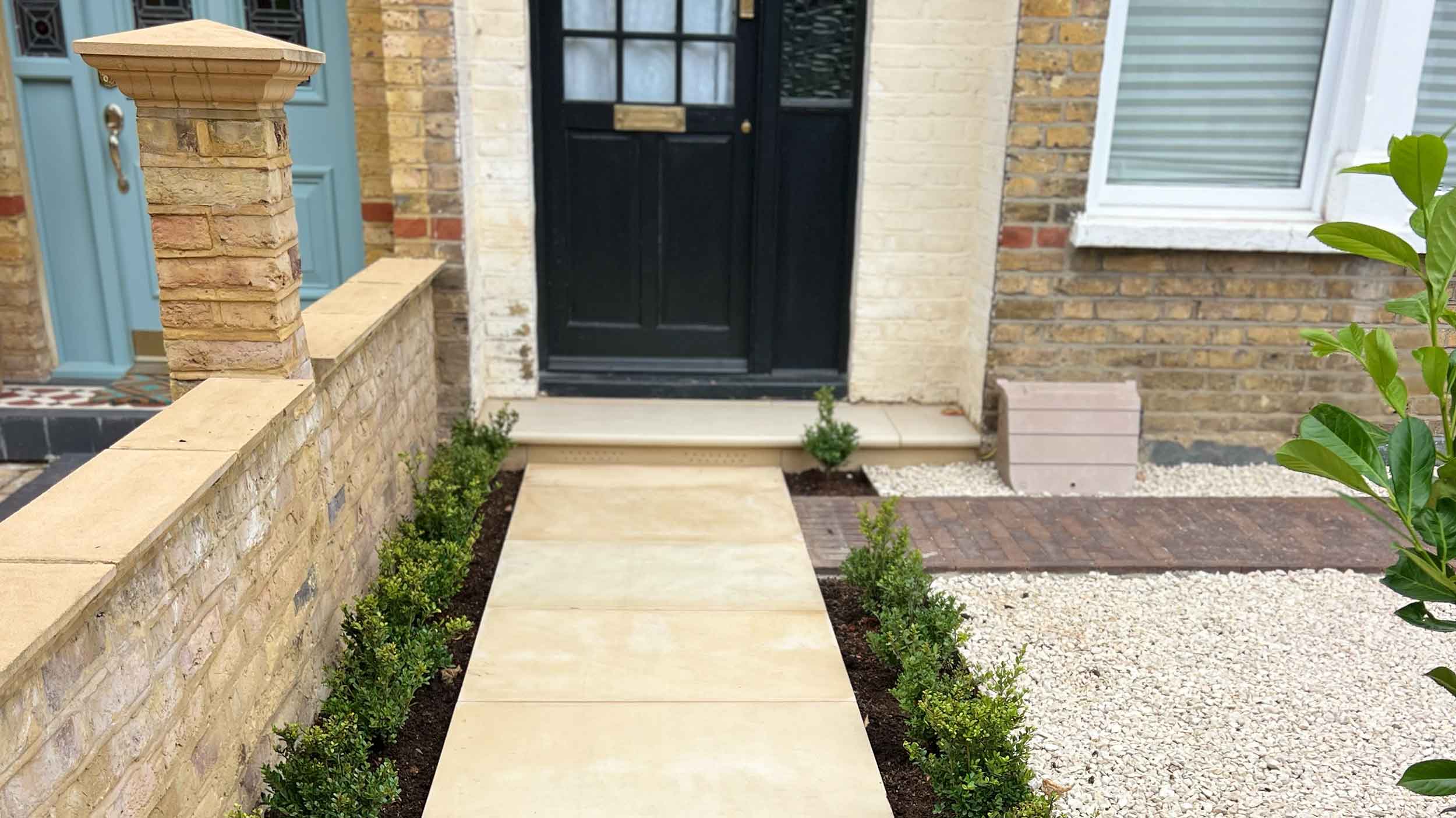 Front garden paving with planted borders