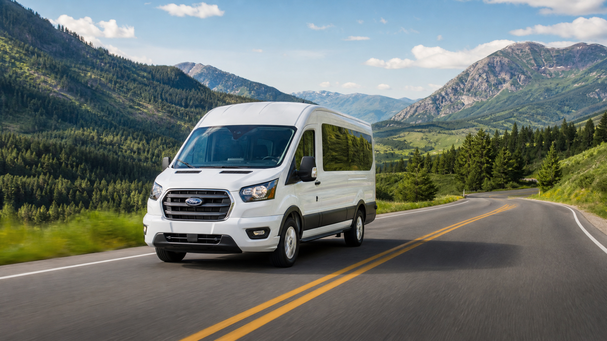 White Ford Transit shuttle van on a scenic mountain road