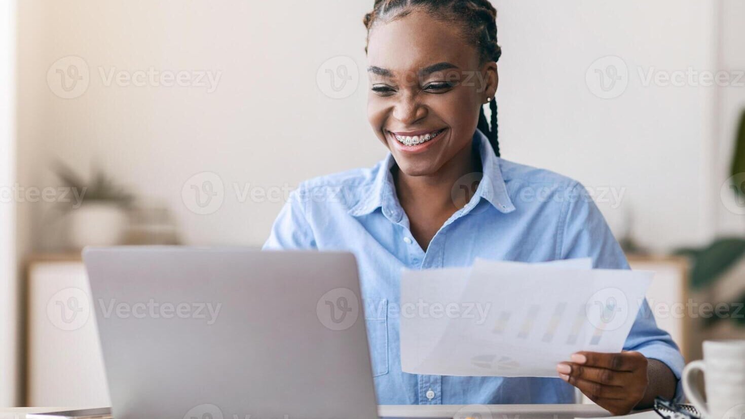 Homeowner reviewing bridge loan financial documents on laptop