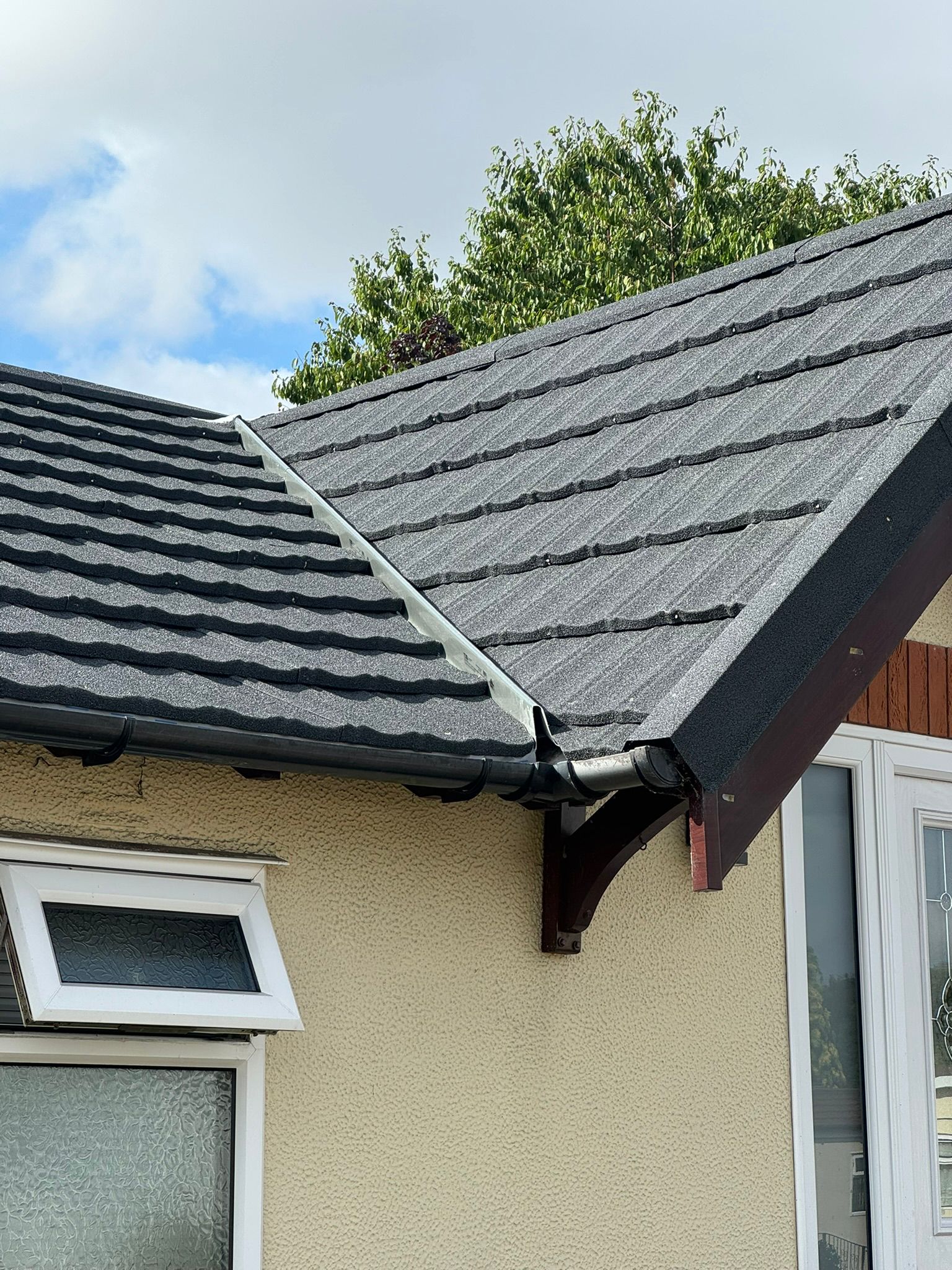 New roof tiles with fascia, ridge detail and guttering on a park home