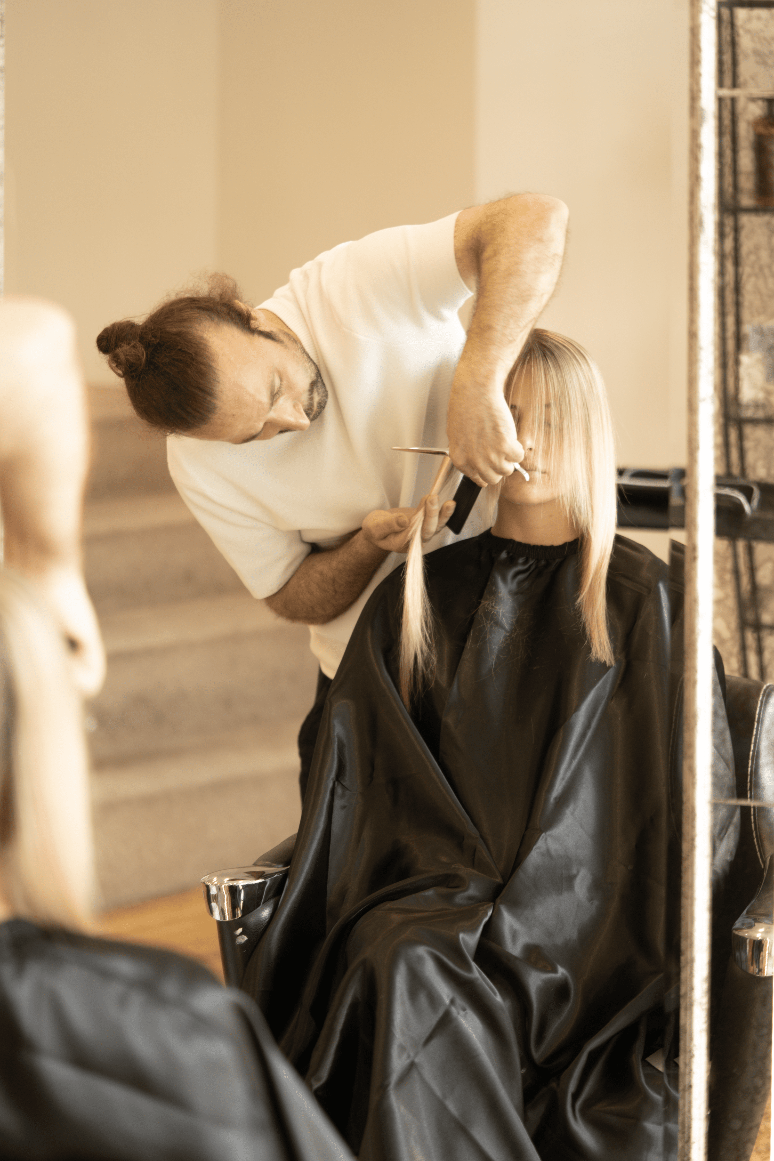 Akif working on a client at TOQQA Hair Salon Chelsea - Precision Cuts & Blow Dry