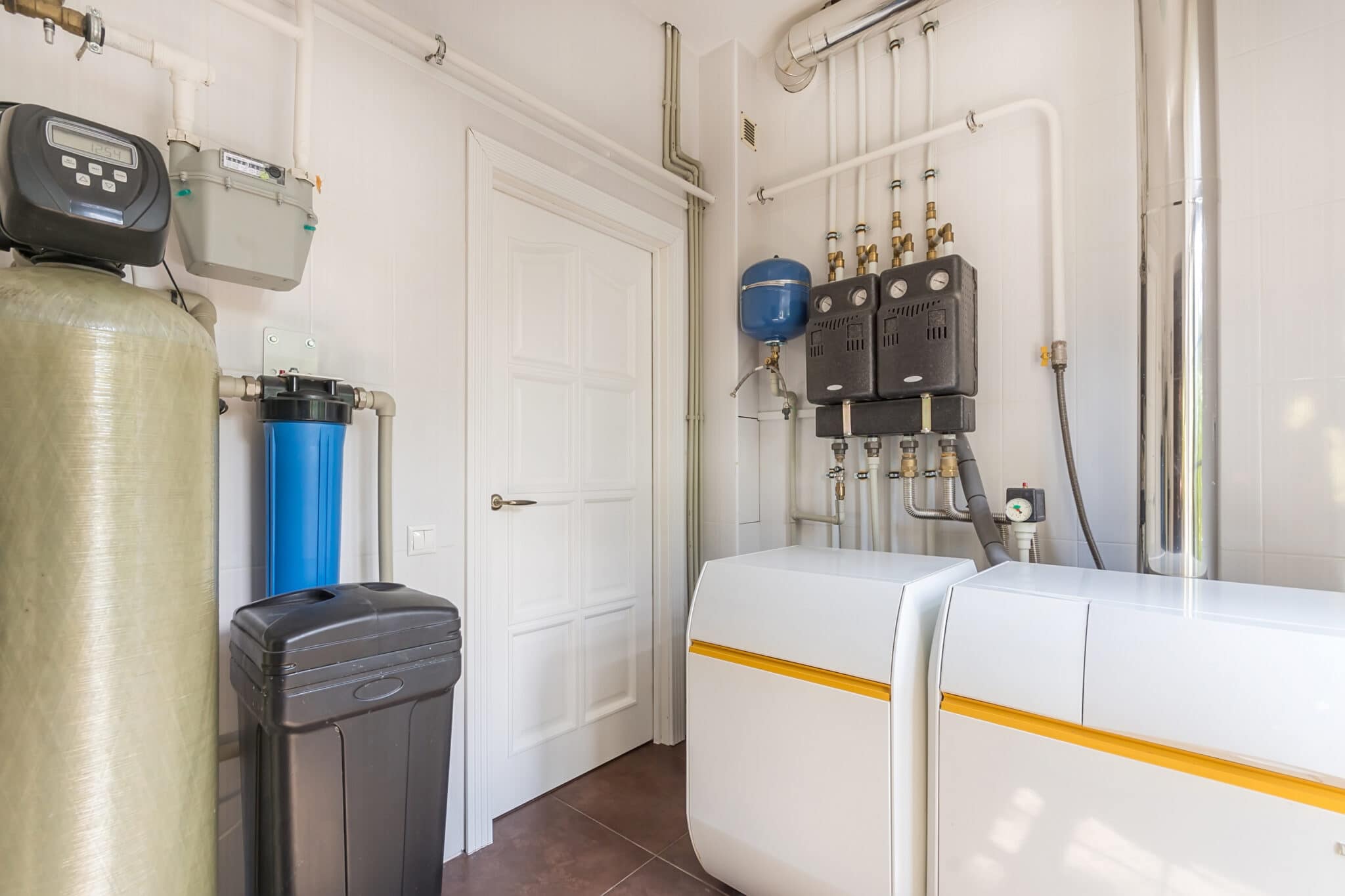 Modern water softener system installed in a San Antonio home garage