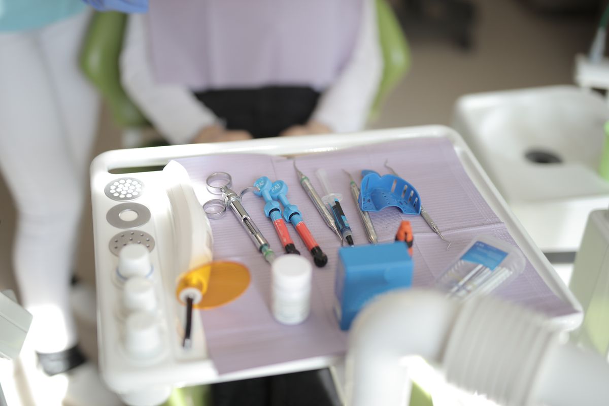 Dental professional providing emergency help for a lost filling or crown assessment