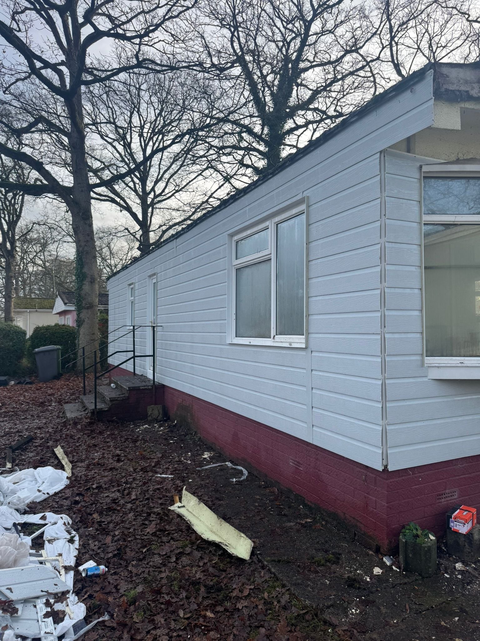 Park home exterior with newly installed cladding panels