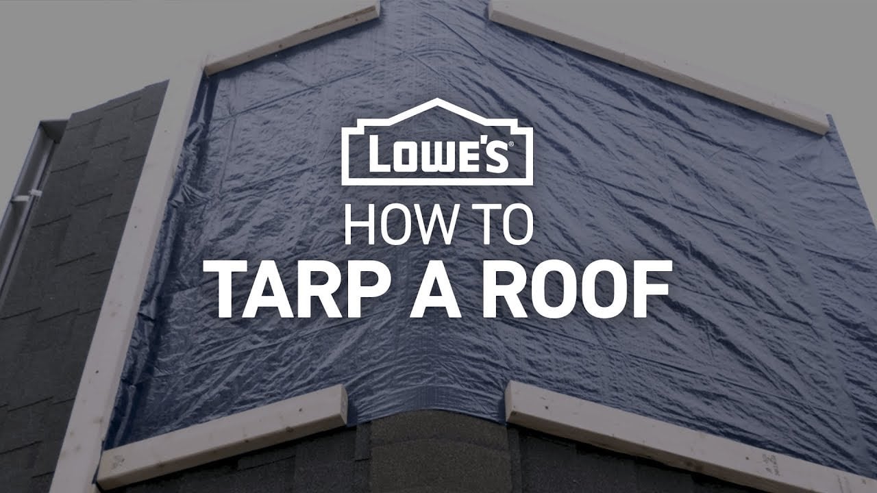 Emergency tarpaulin roof repair after storm