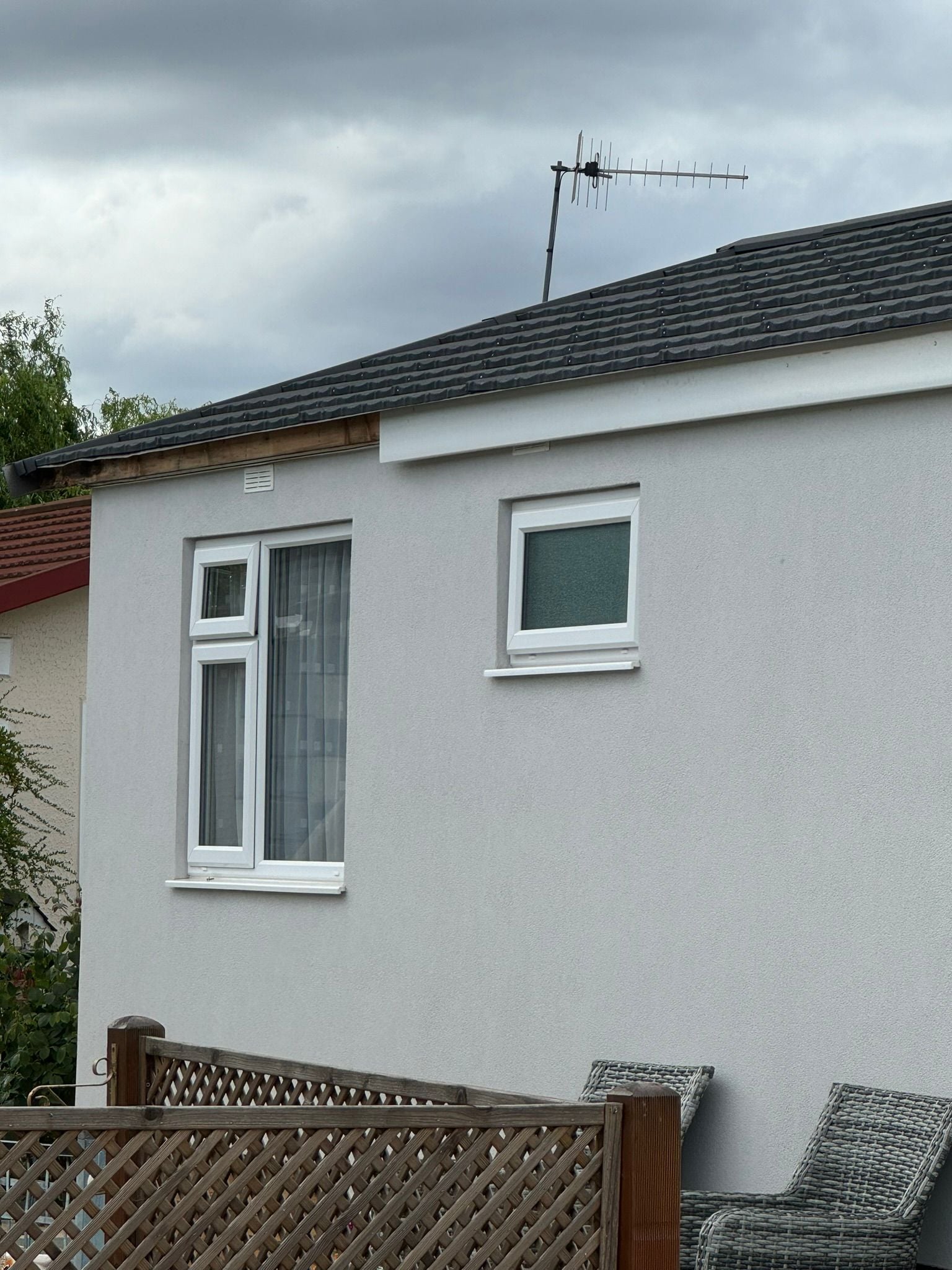 Completed park home exterior renovation with fresh cladding and trim details