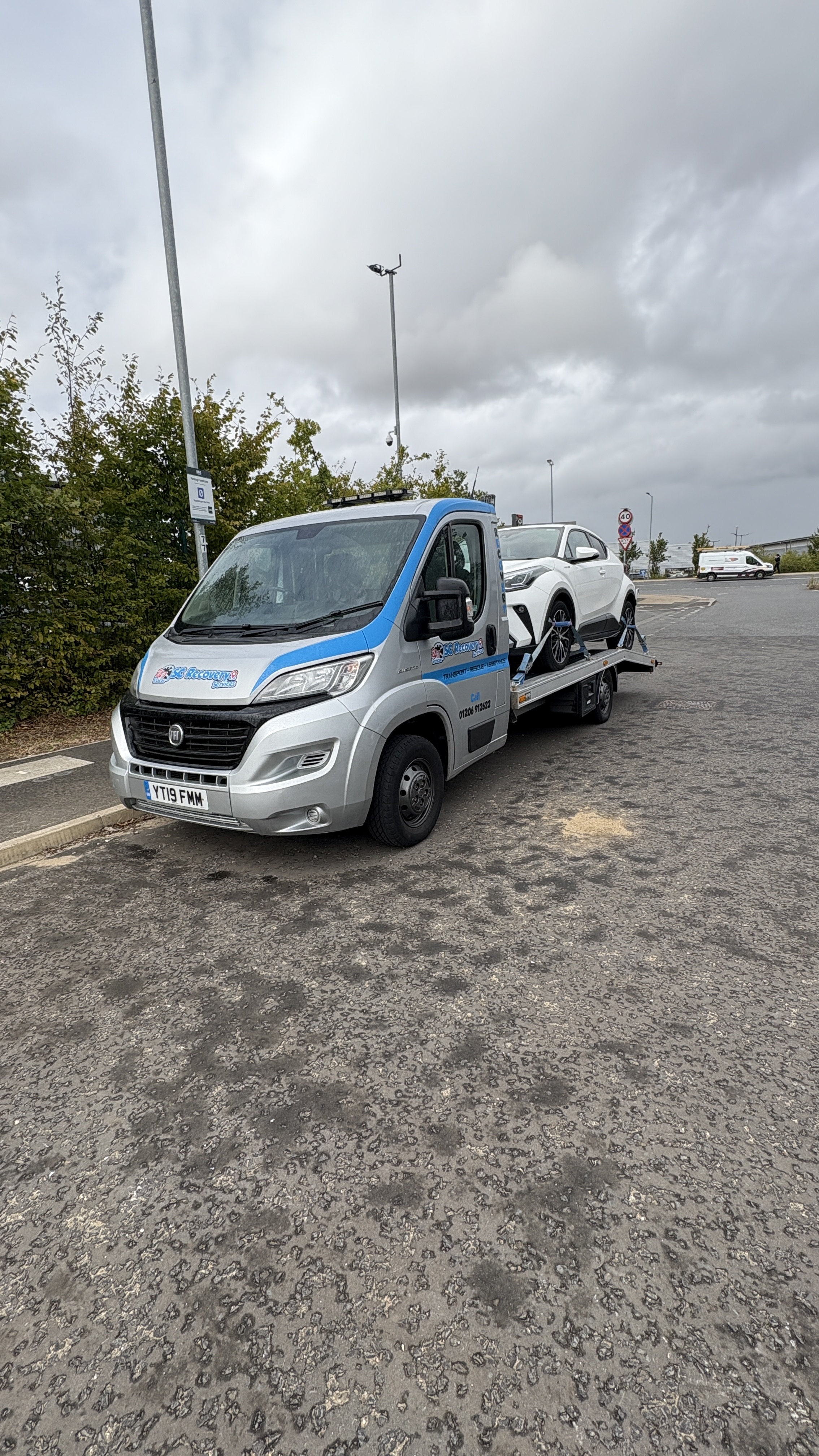 SC Recovery tilt-bed truck ready for loading