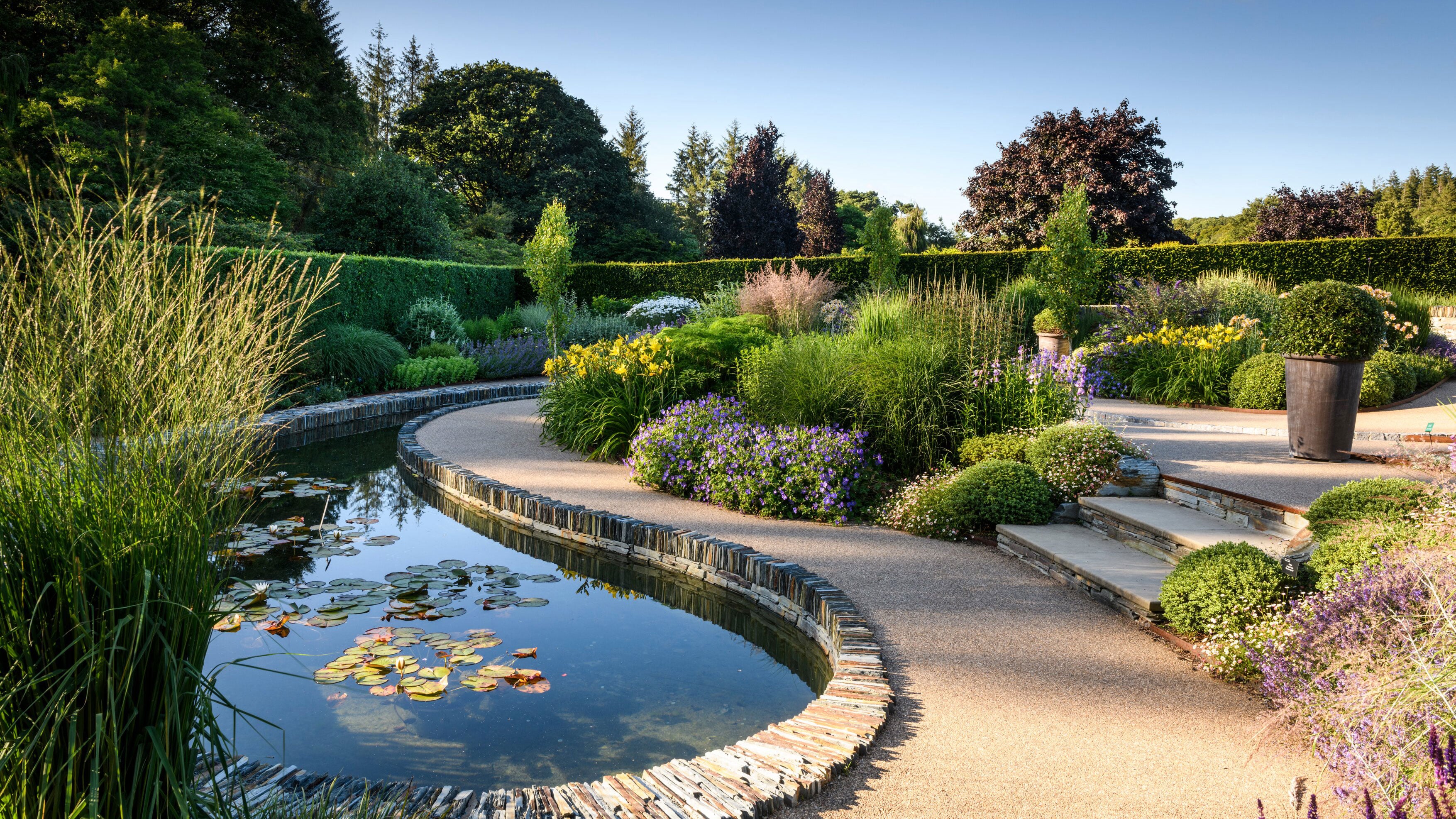 Garden water feature with stone pathway