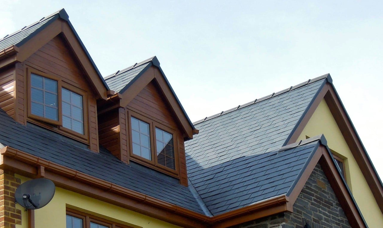 Black slate roof with continuous dry verge system