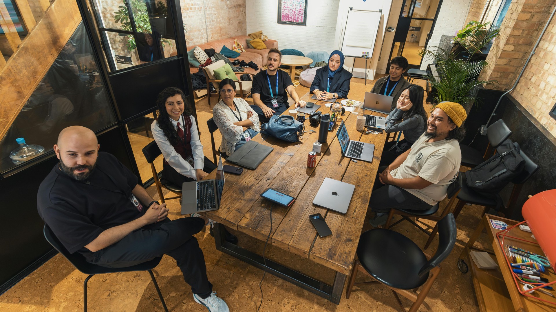 Young professionals working together in a modern tech workspace