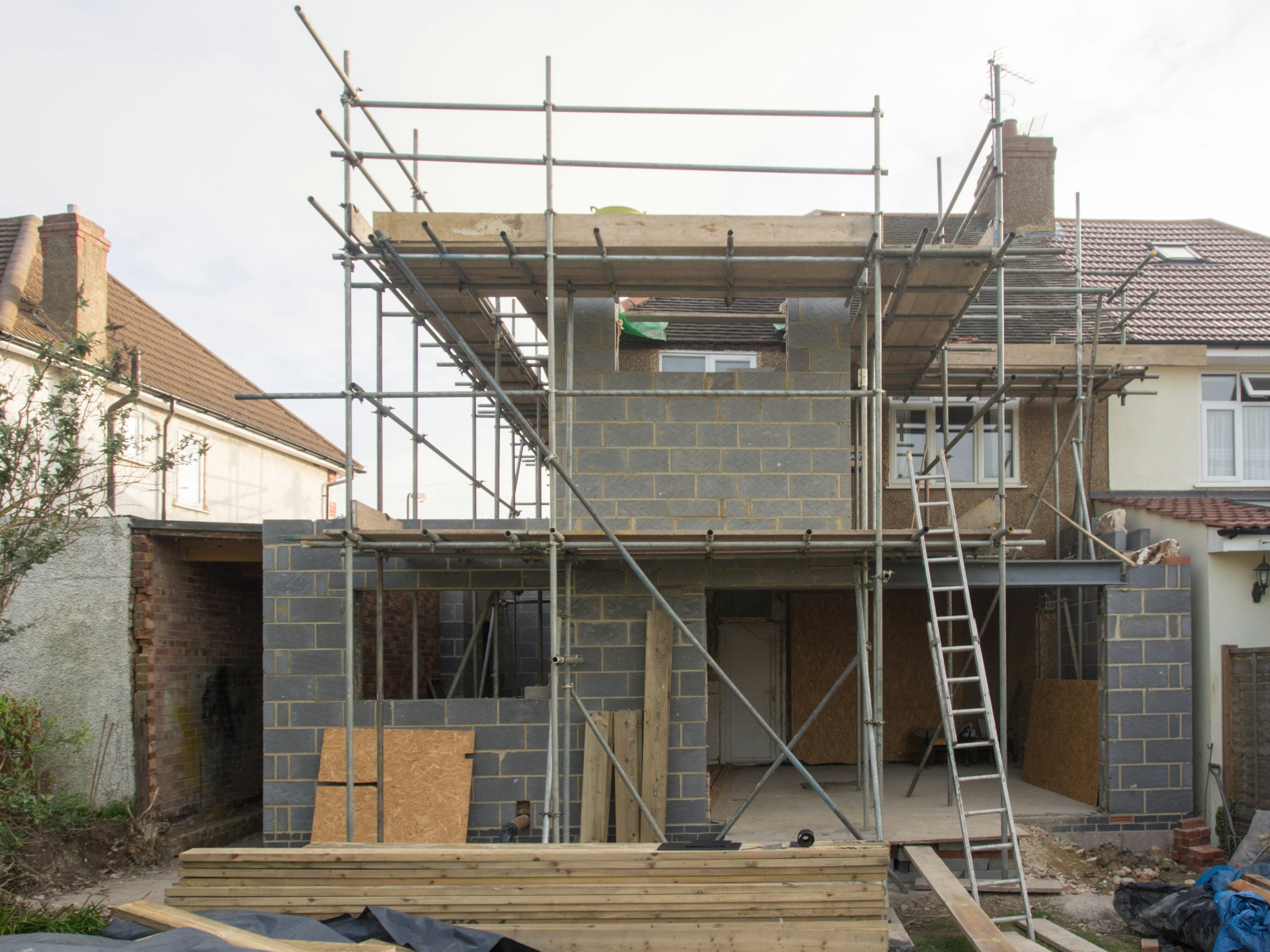 Scaffolding around a UK house extension roof