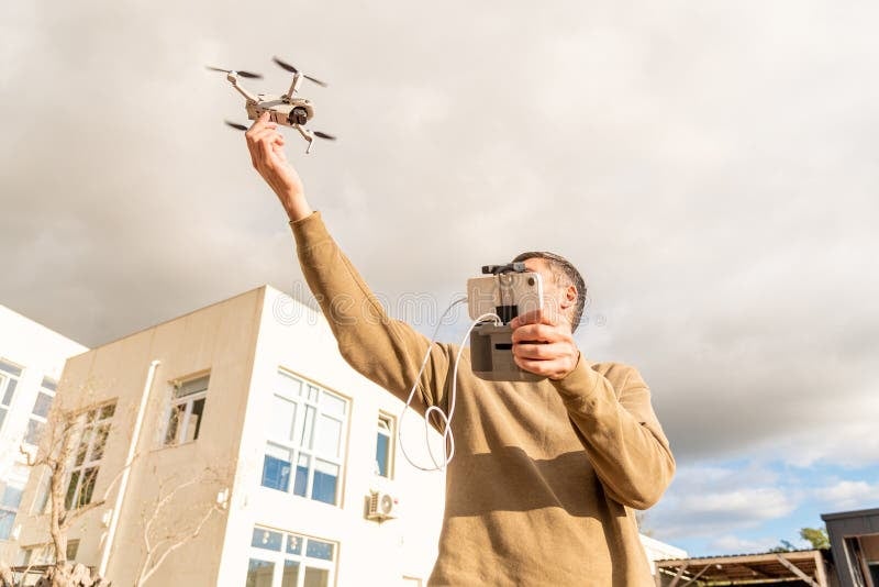 Professional drone operator preparing equipment for a flight