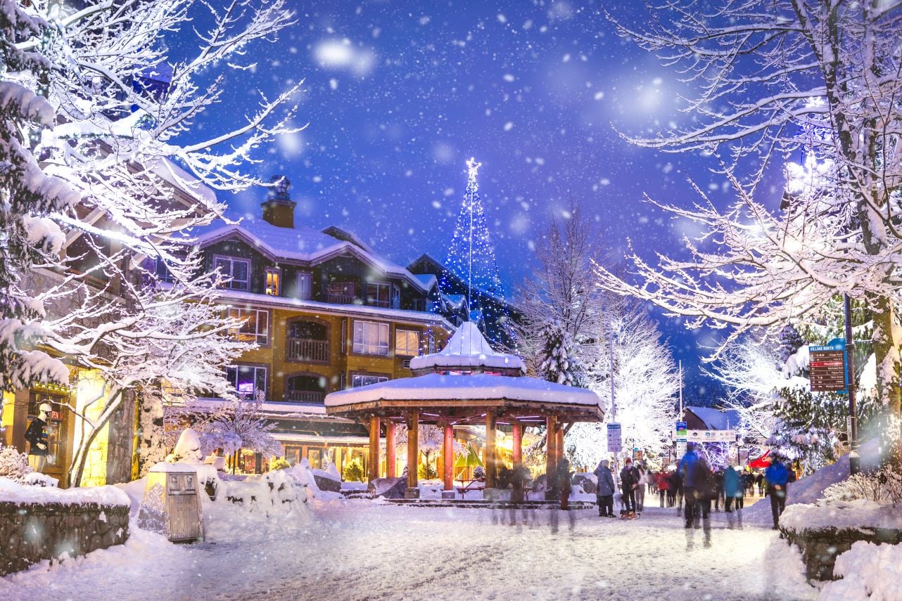 Whistler Village at night with restaurants and shops