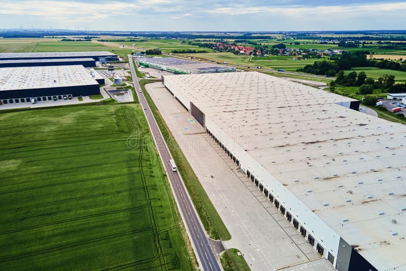 Aerial view of a modern distribution hub with trucks at loading docks