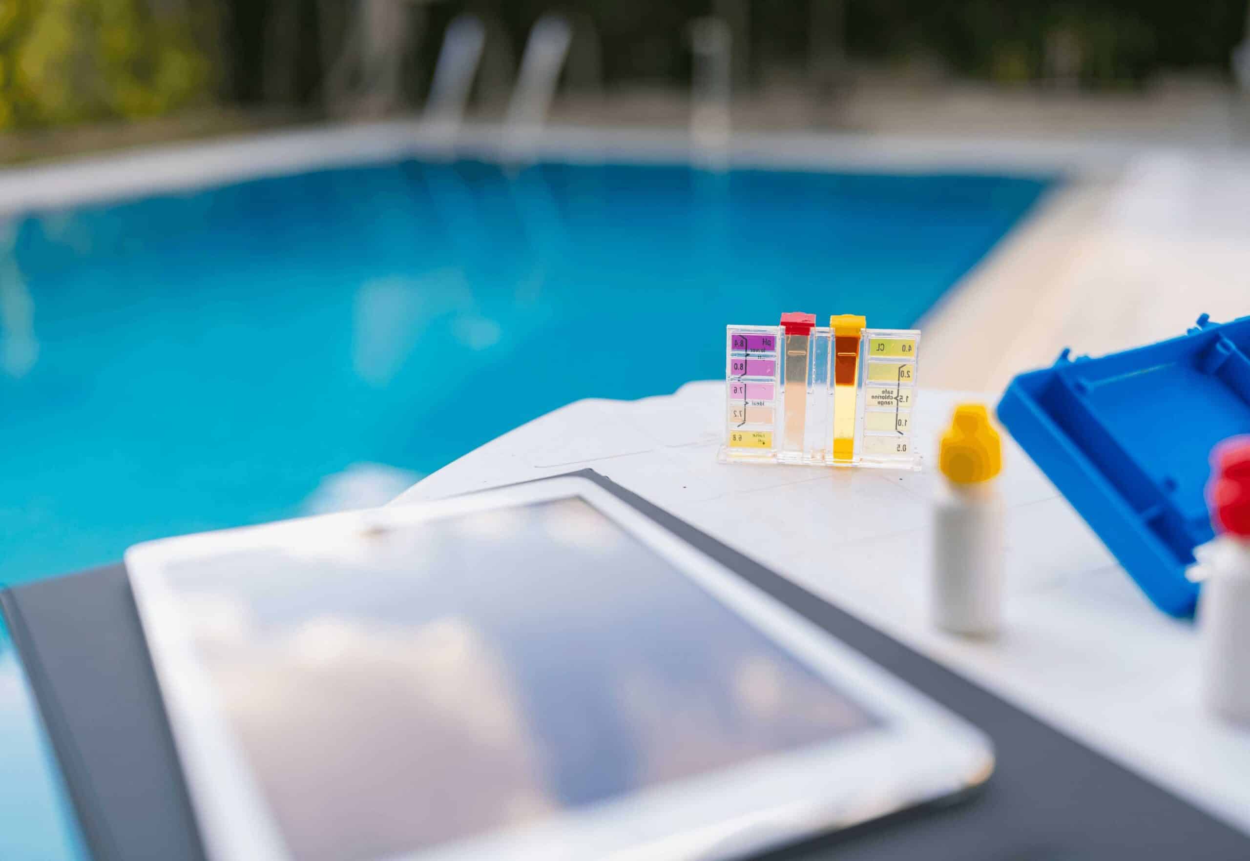 Professional pool maintenance service — technician testing water chemistry