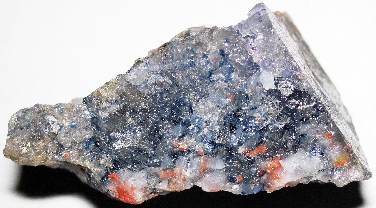 Reddish potash mineral