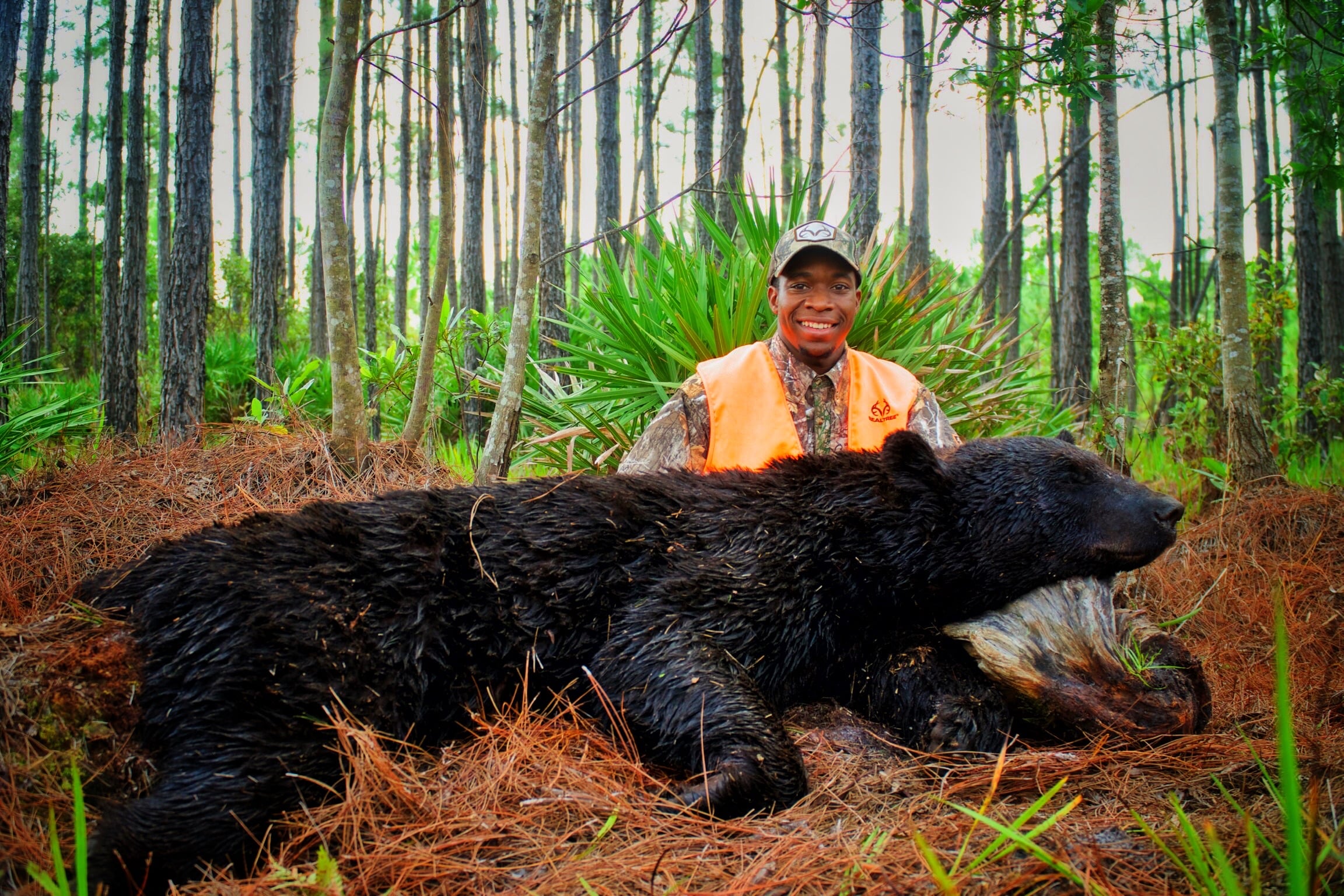 Joshua Carney with a Florida black bear -- Son of the South