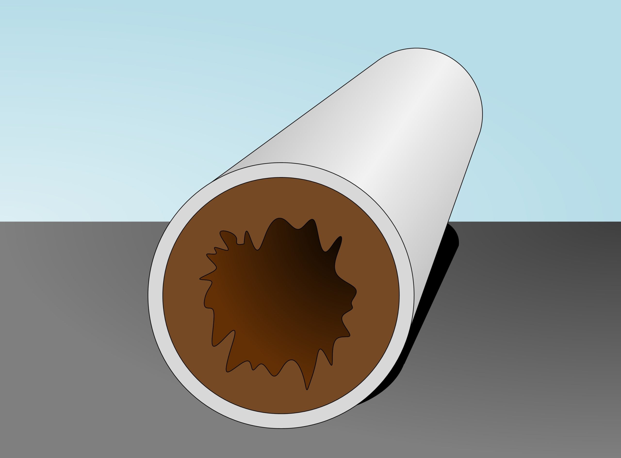 Cross-section of a pipe showing severe limescale buildup from hard water