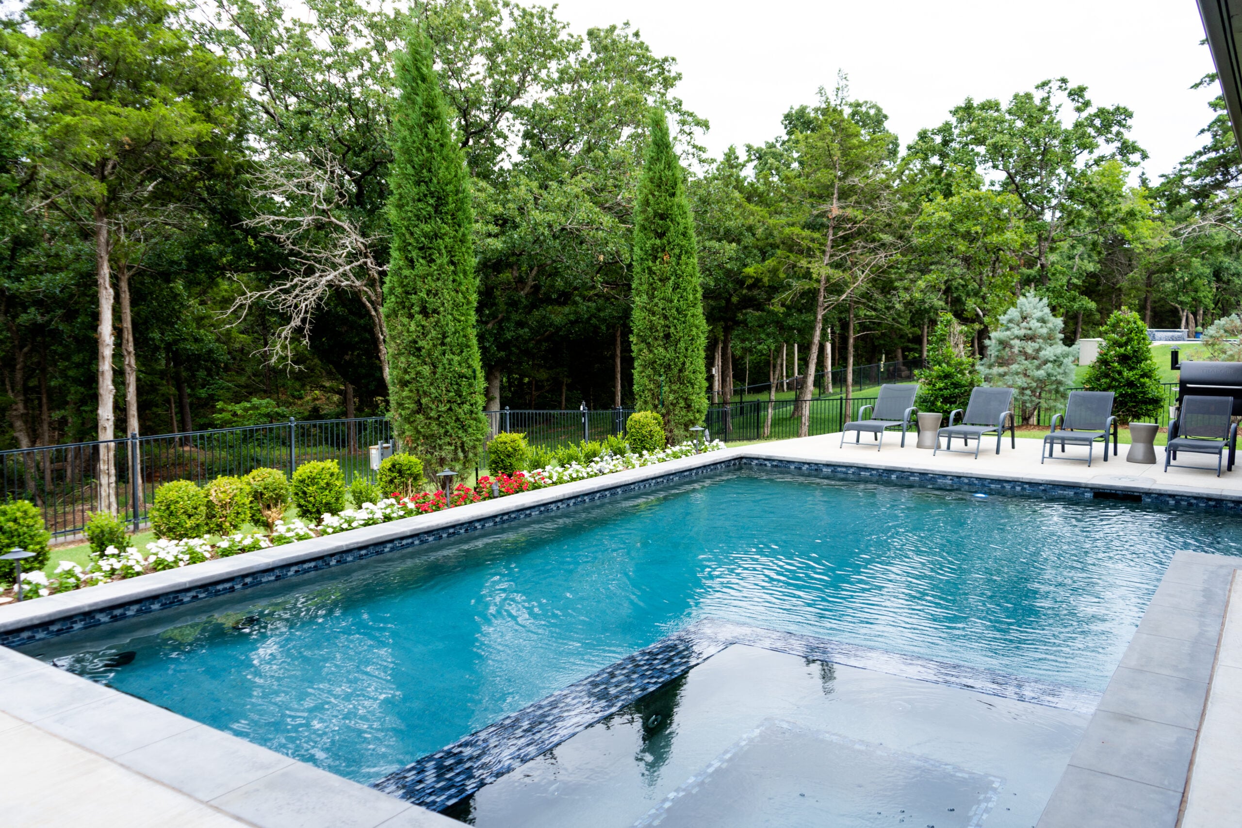 Crystal clear sparkling swimming pool with professional weekly service