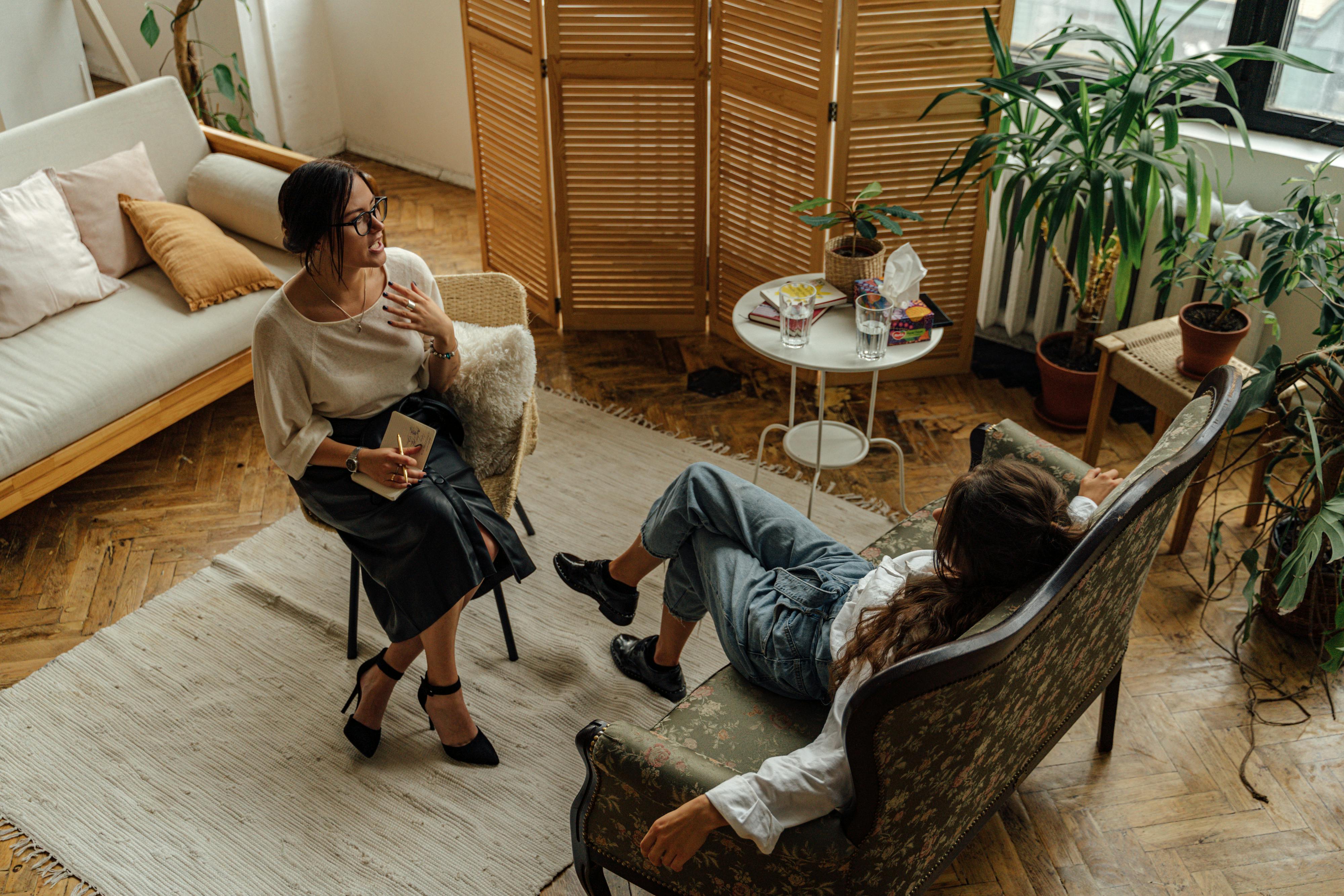 Professional therapy session showing supportive mental health treatment