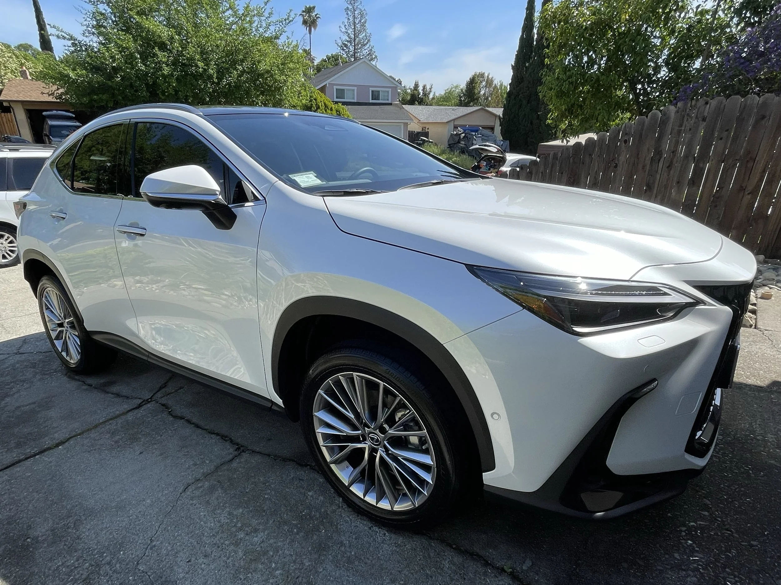 Silver car with flawless paint finish after professional painting