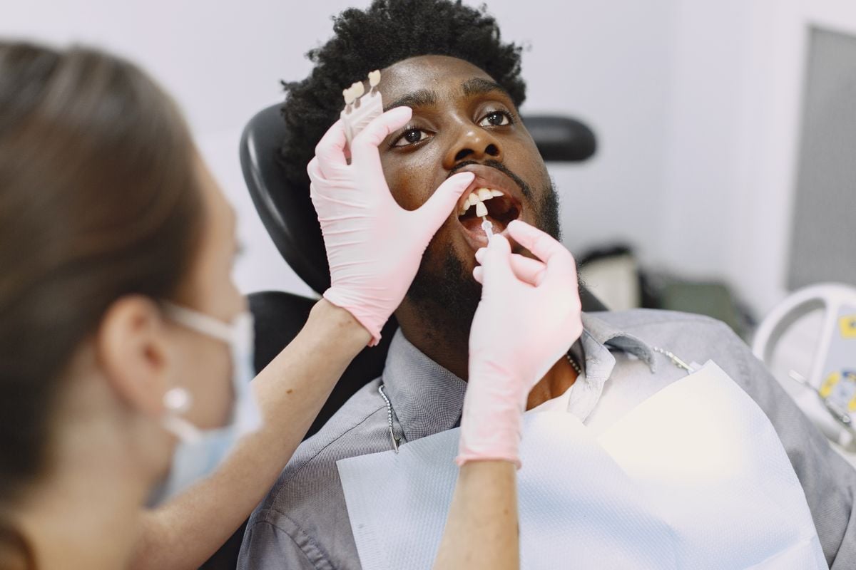 Dental professional providing urgent help for a dental abscess or swelling assessment