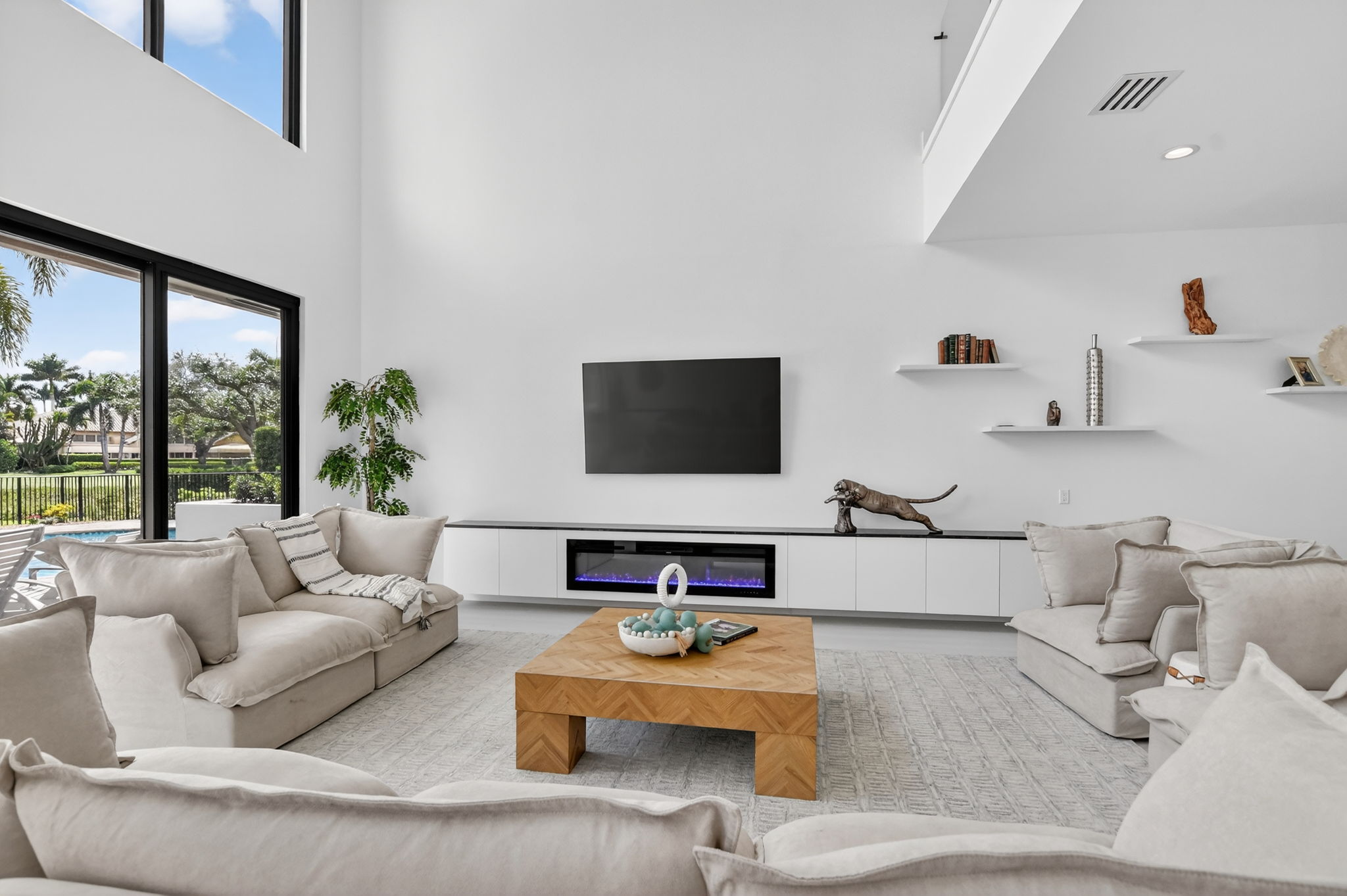 Living room with fireplace and TV