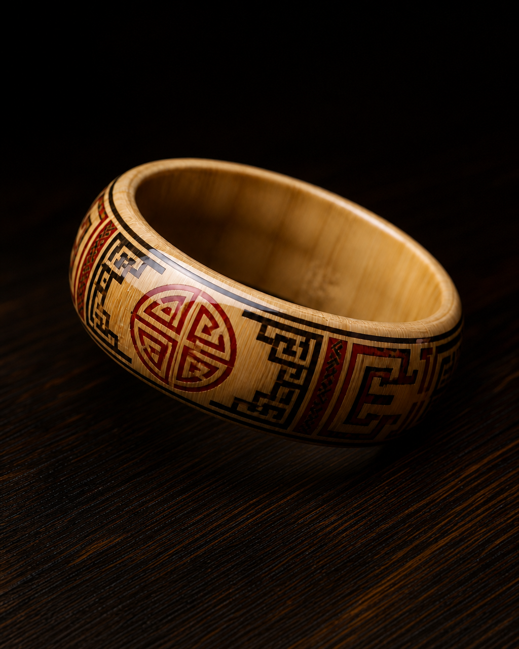 The Hoi An Bangle, lacquered bamboo with red and black motifs