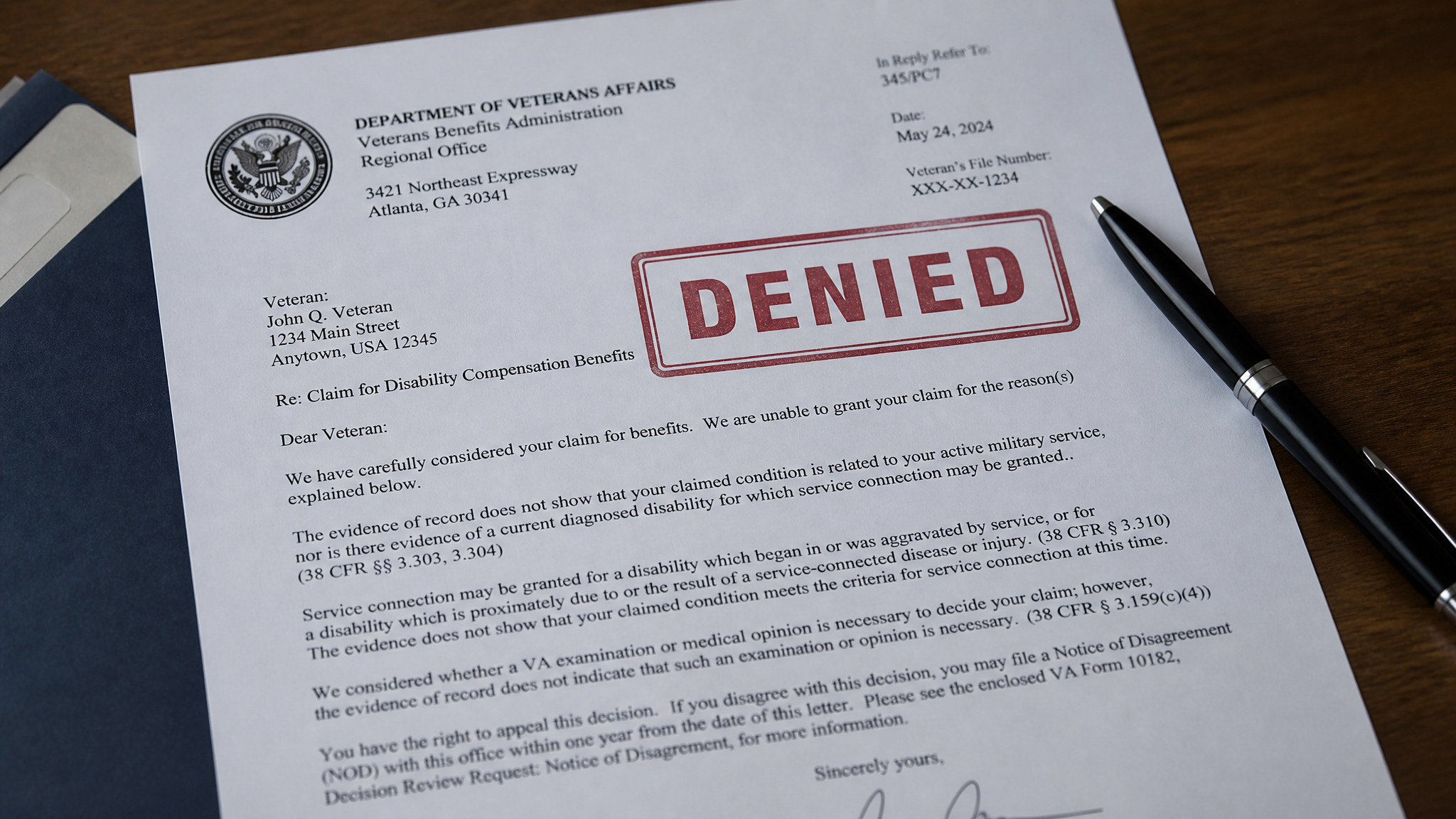 A government claim decision letter stamped DENIED in red, representing a claim that can be reopened