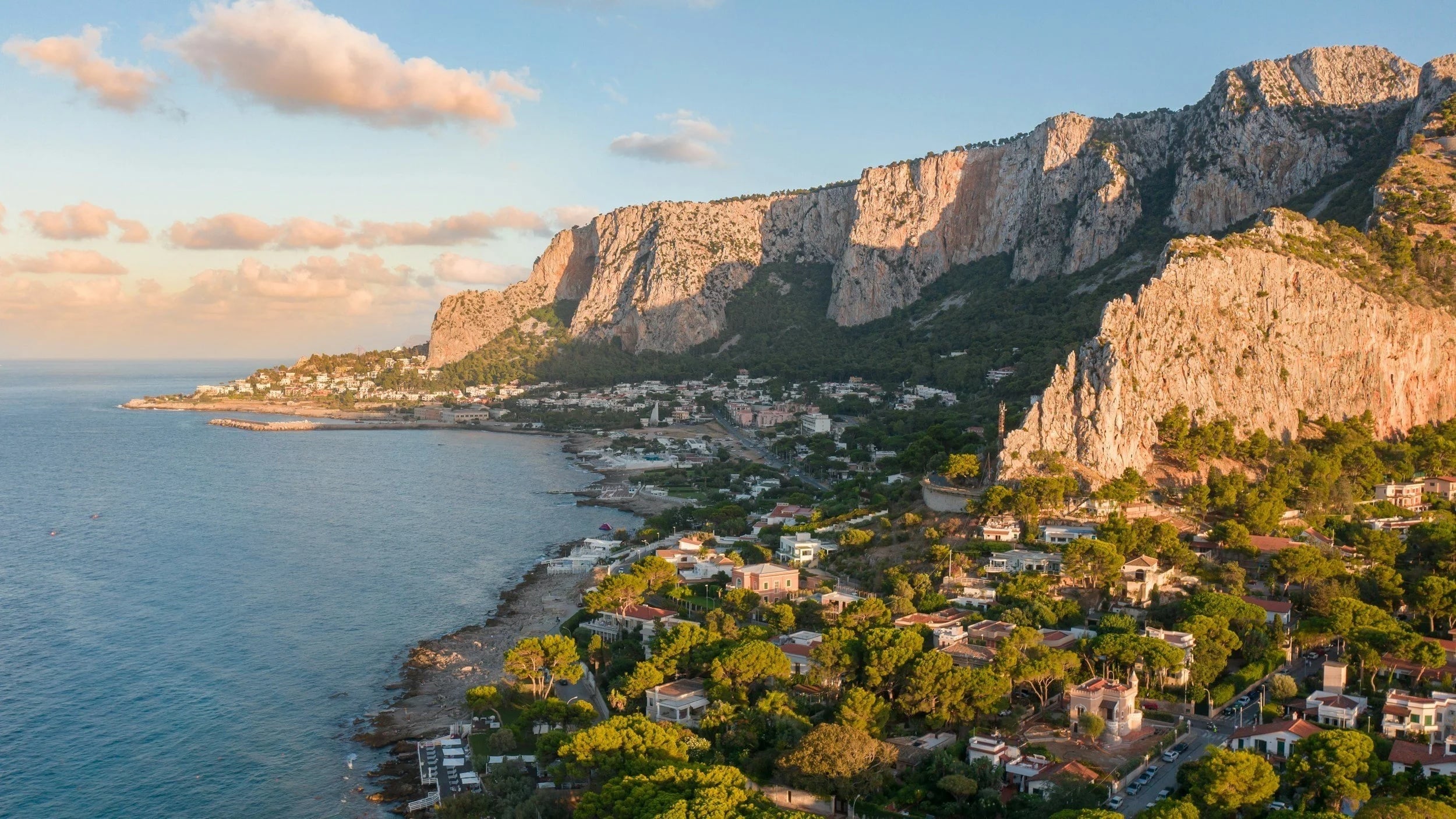 Romantic golden sunset over Sicily coastline - perfect destination for dream weddings