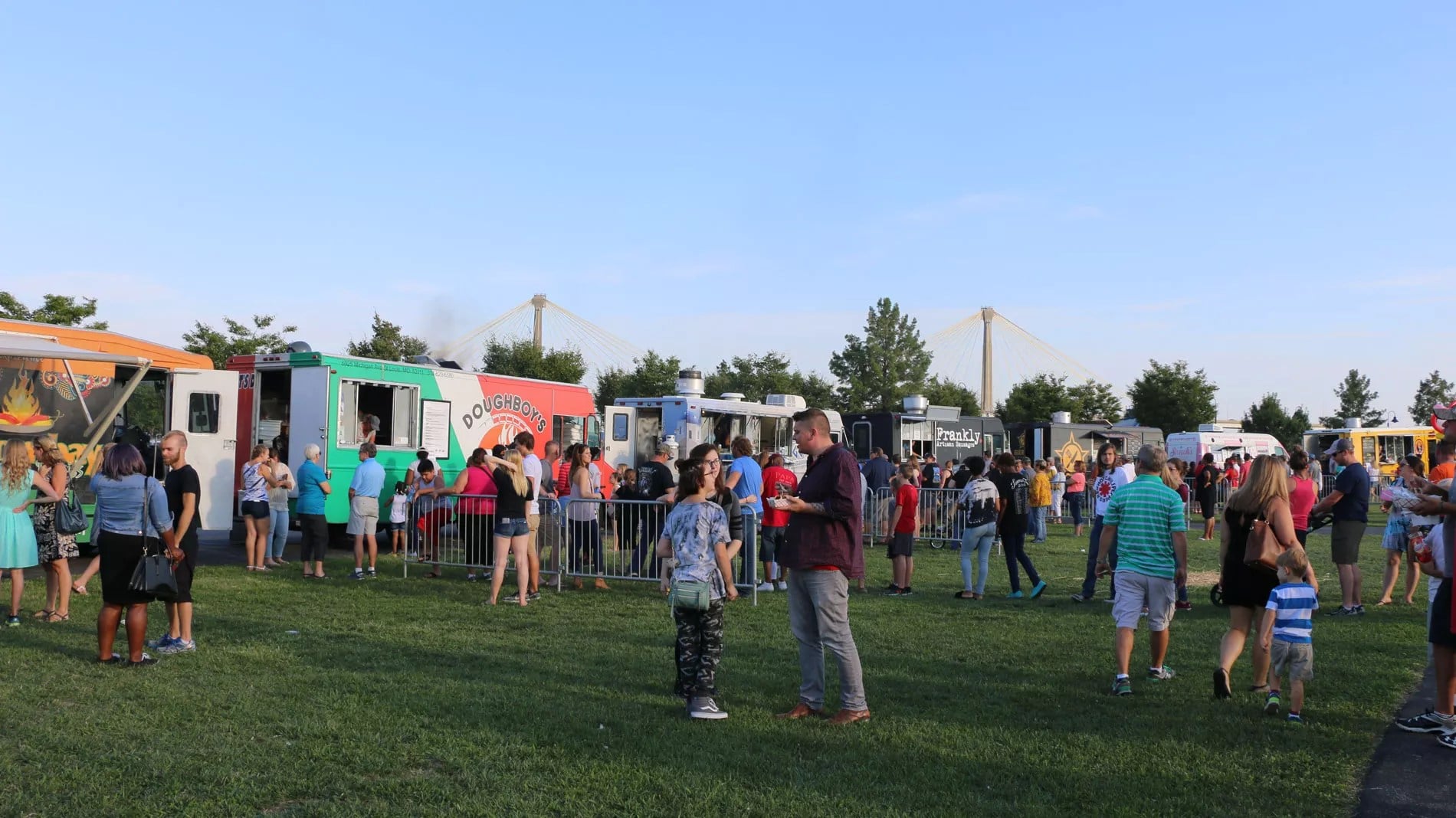 Community event festival with food trucks and crowds