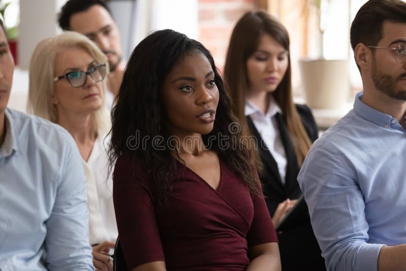 Black professional leading a business workshop presentation