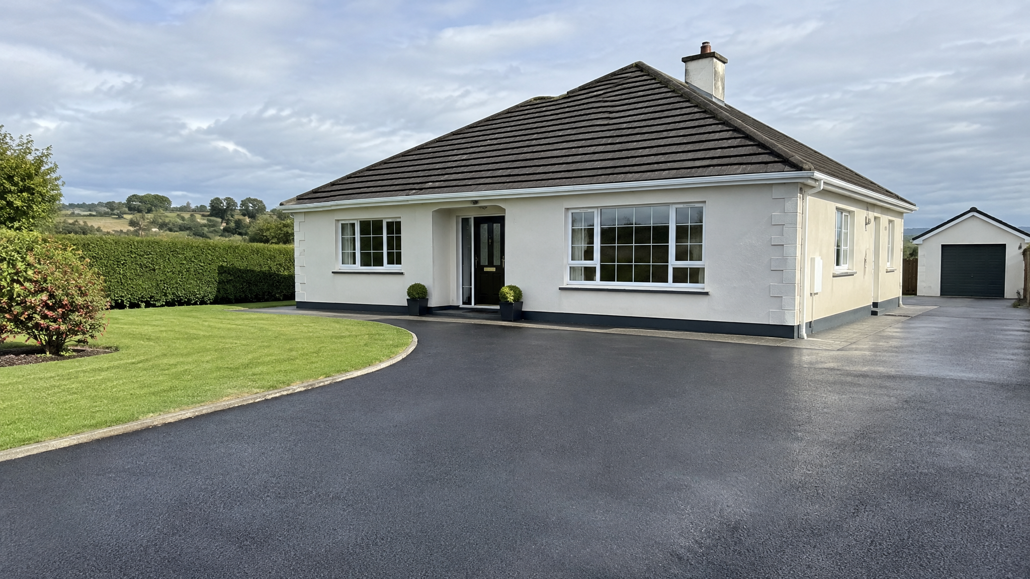Freshly cleaned tarmac driveway at an Irish bungalow